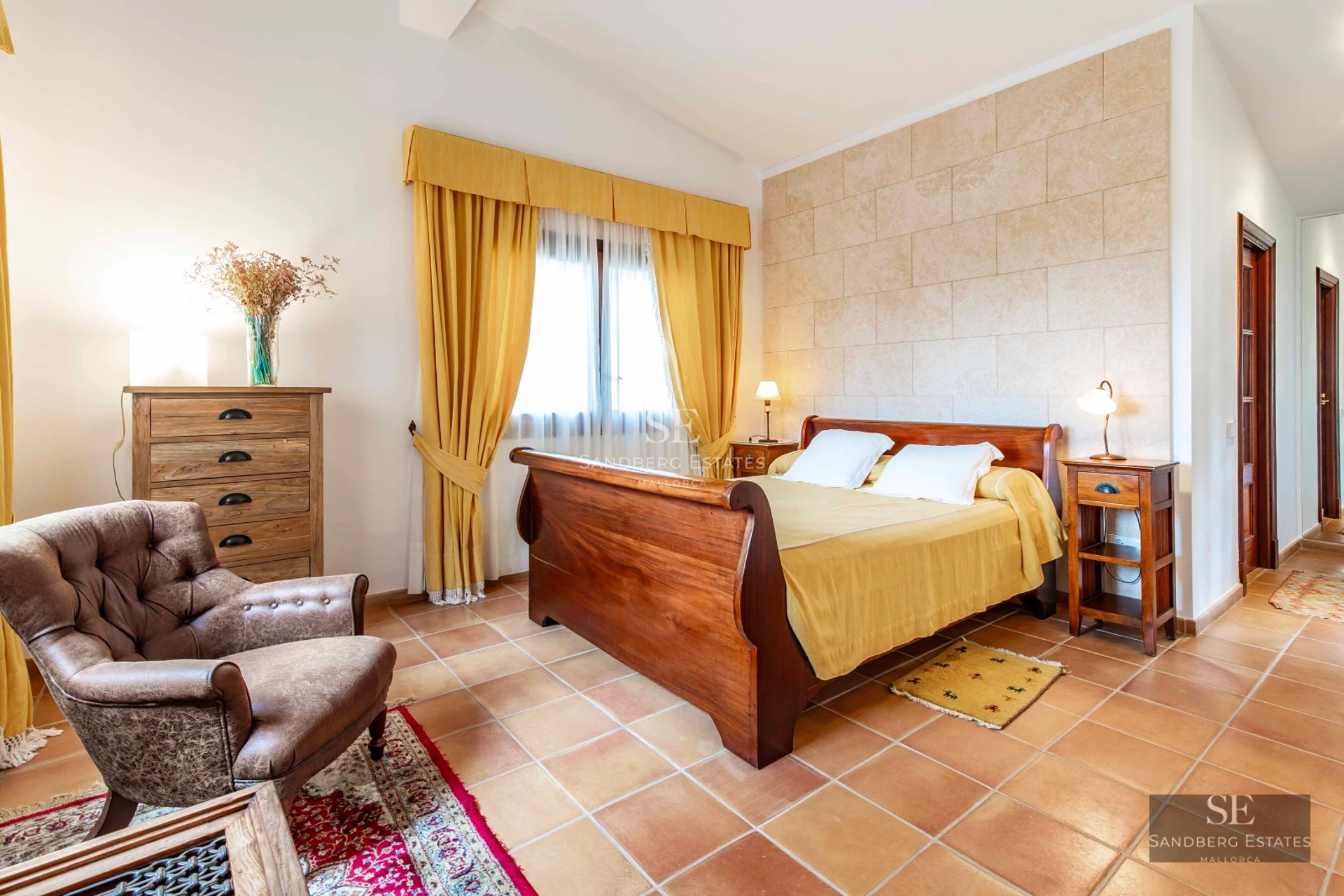 Spacious living room with floor-to-ceiling windows, sea views, and balcony access. Modern and elegant design. Abundant natural light.