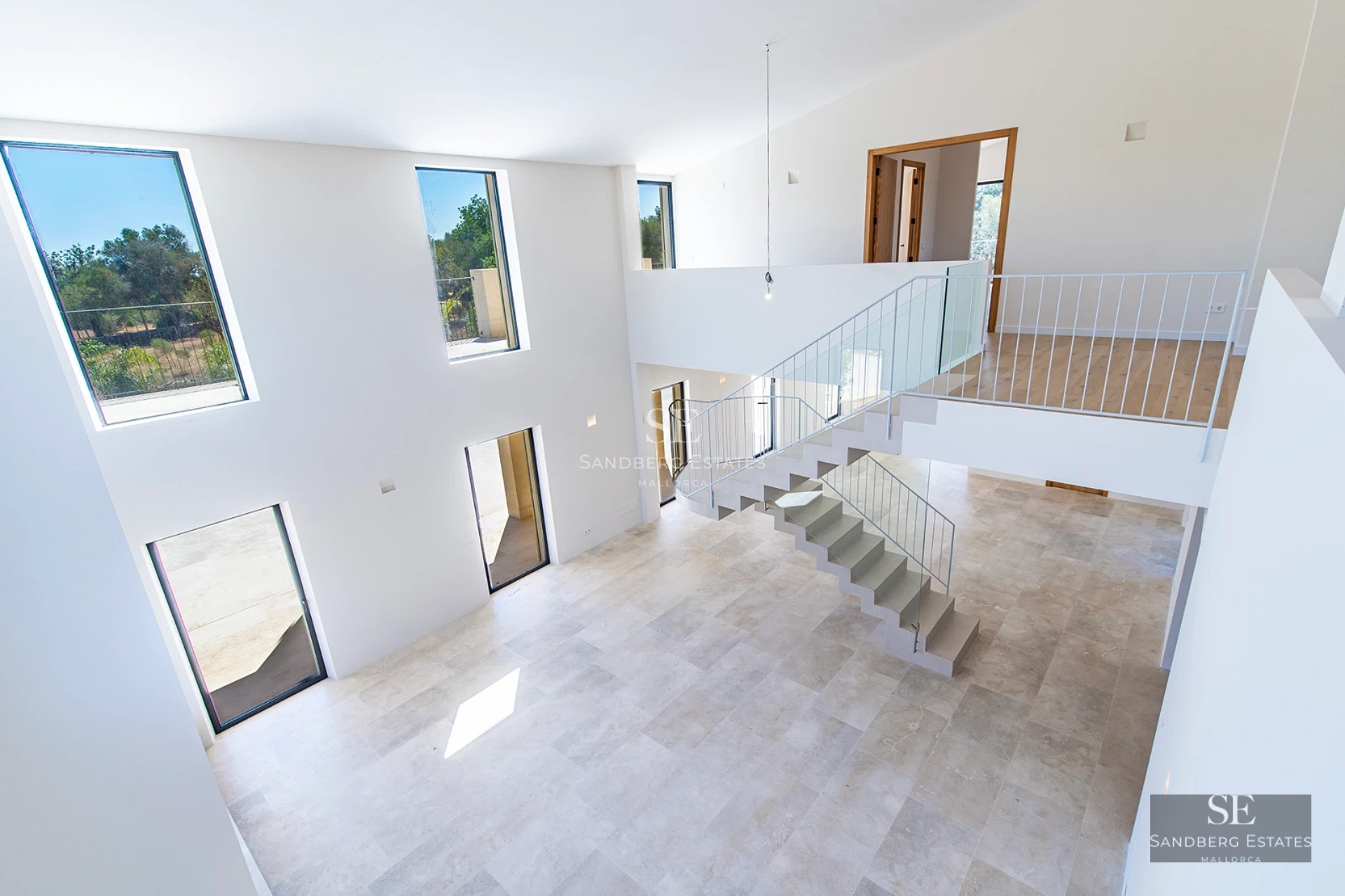 Panoramic view of a modern villa with infinity pool. Minimalist design, large windows, and lush vegetation.