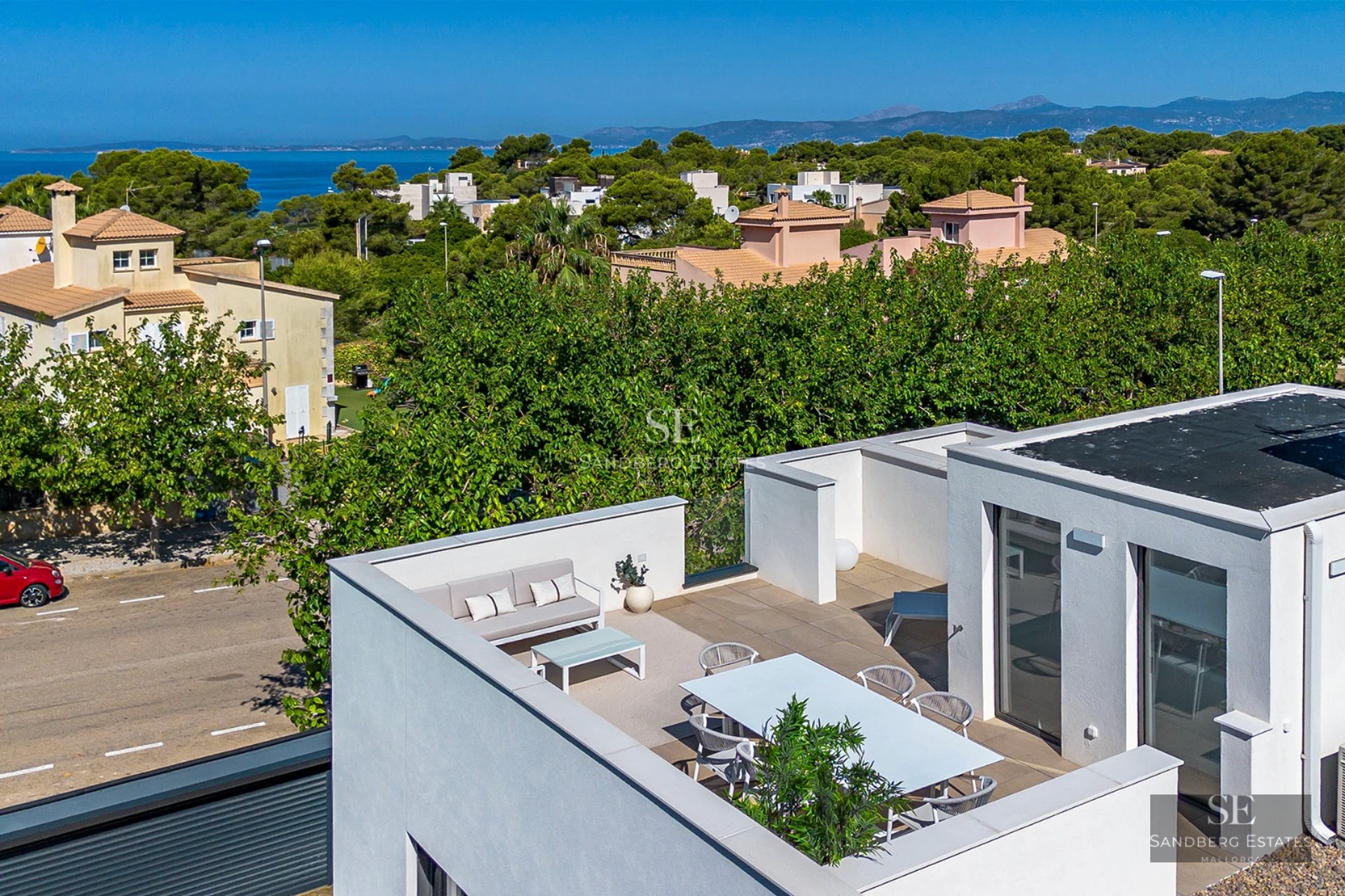 Exterior view of a modern villa with a pool, garden, and terrace. Minimalist design, clean lines, and large panoramic windows.