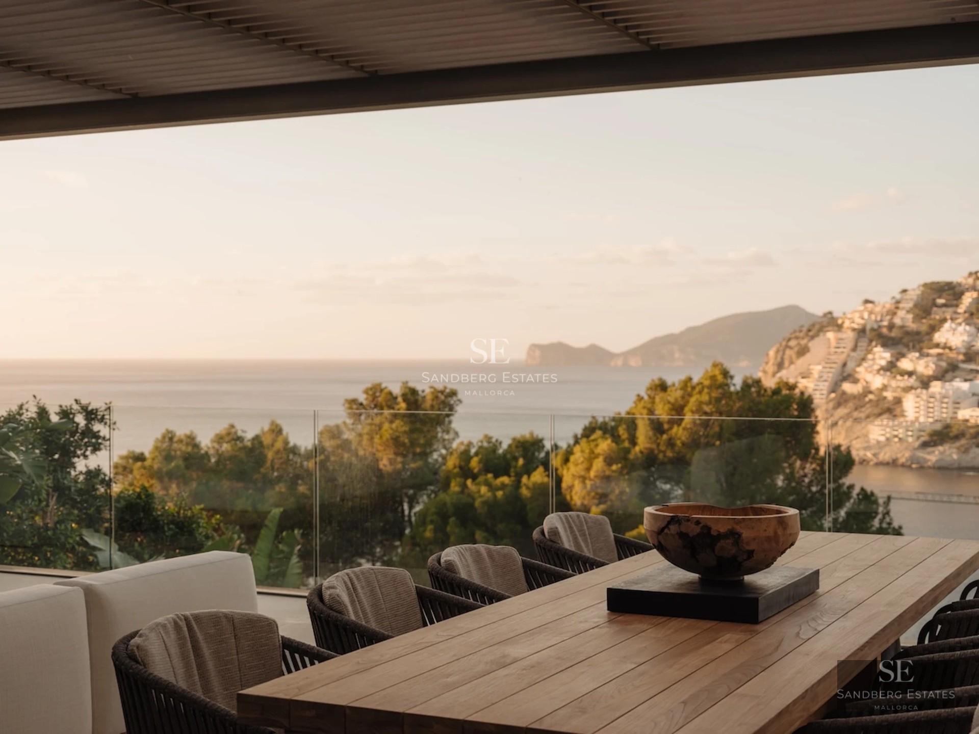 Exterior view of a modern house with a pool, lush garden, and large windows. Minimalist design with clean lines.