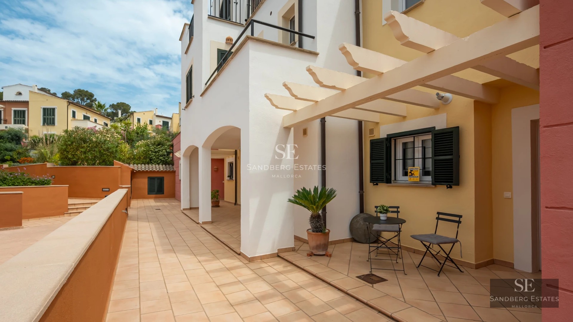 Exterior view of luxury villa with infinity pool, lush garden, and modern architecture. Minimalist design with large windows.