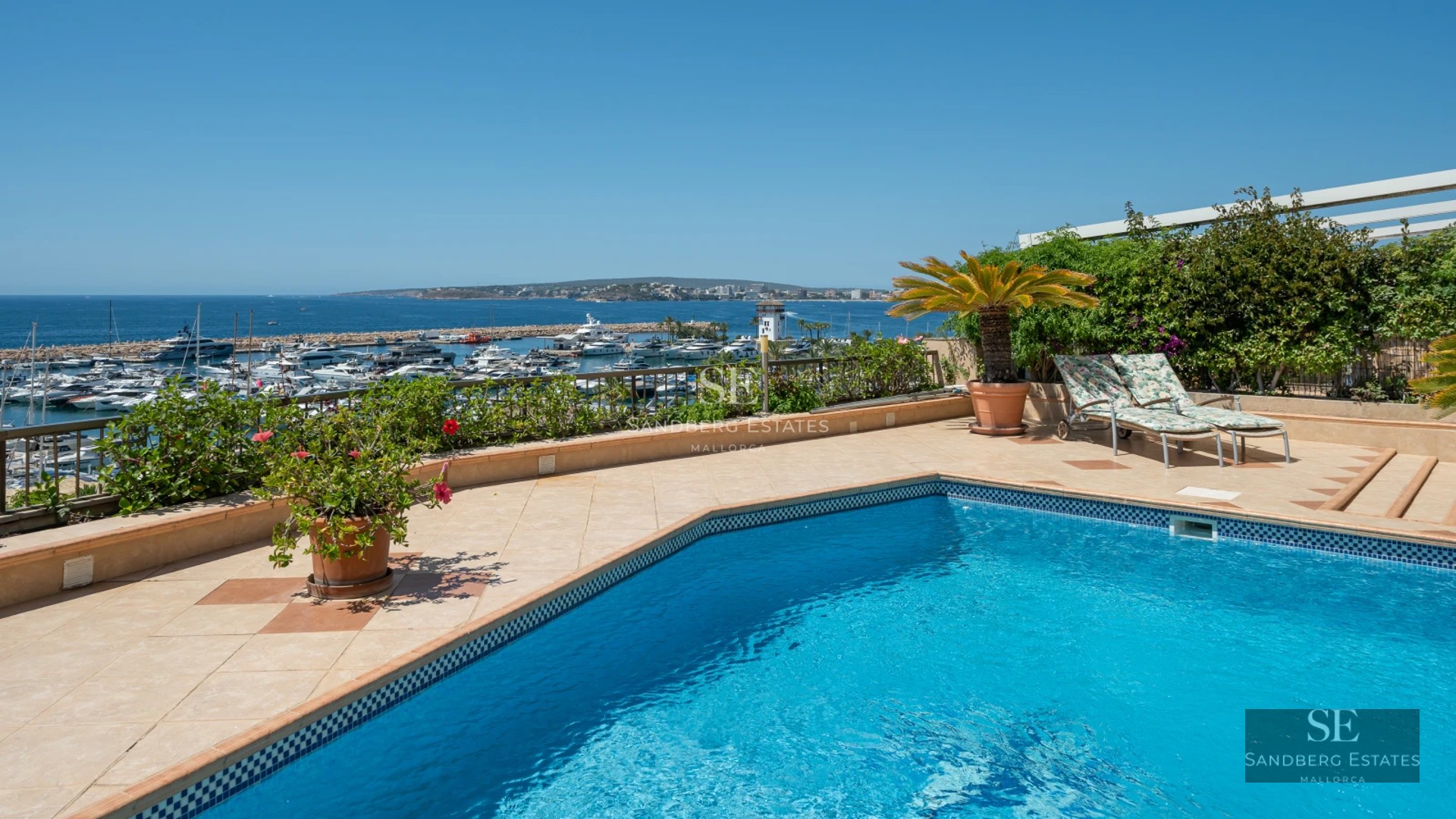 Spacious living room with balcony and sea view. Modern design, wood floors, and natural light.
