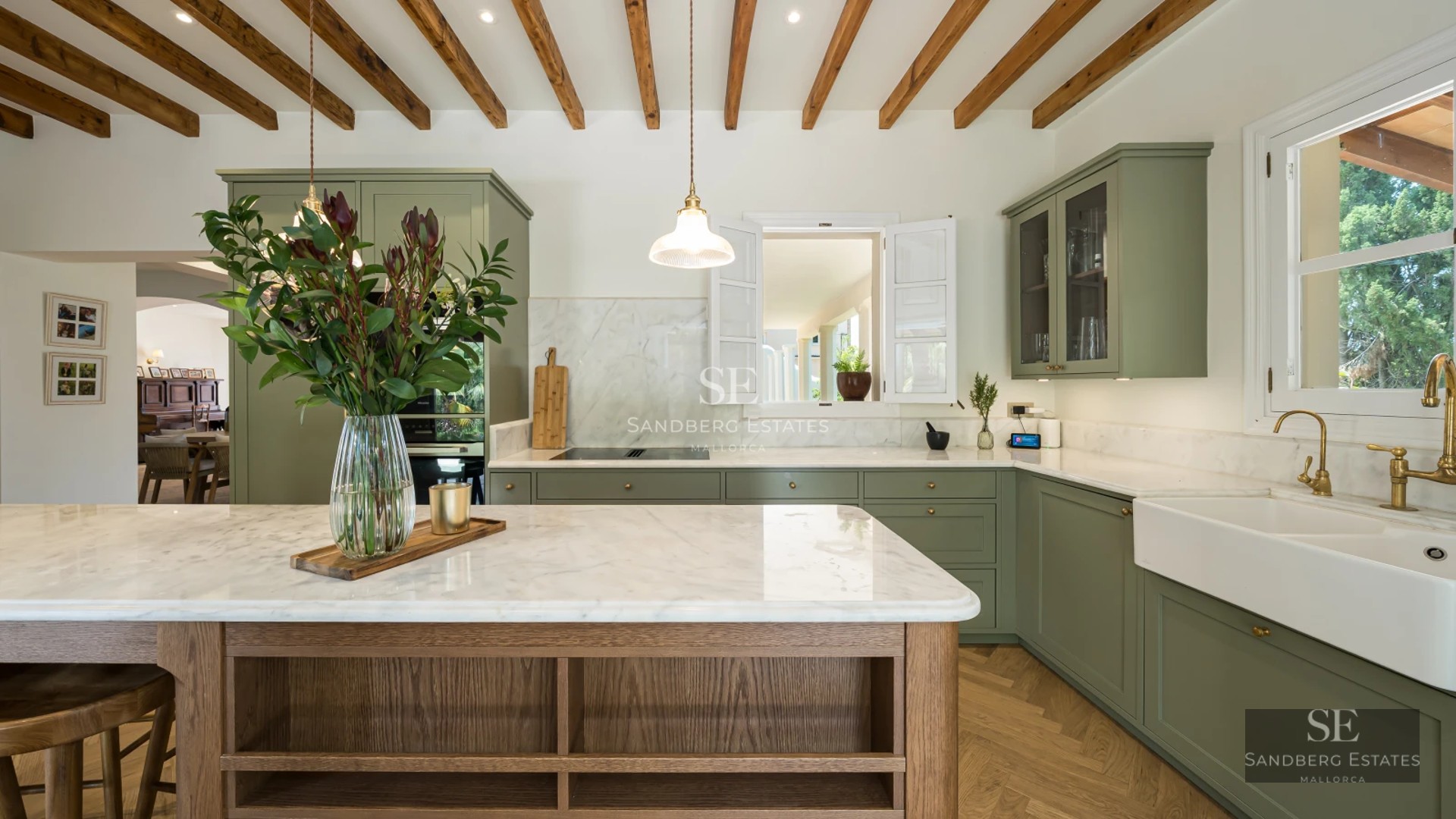 View of modern infinity pool surrounded by greenery. Minimalist design, ambient lighting, and ample space for relaxation.