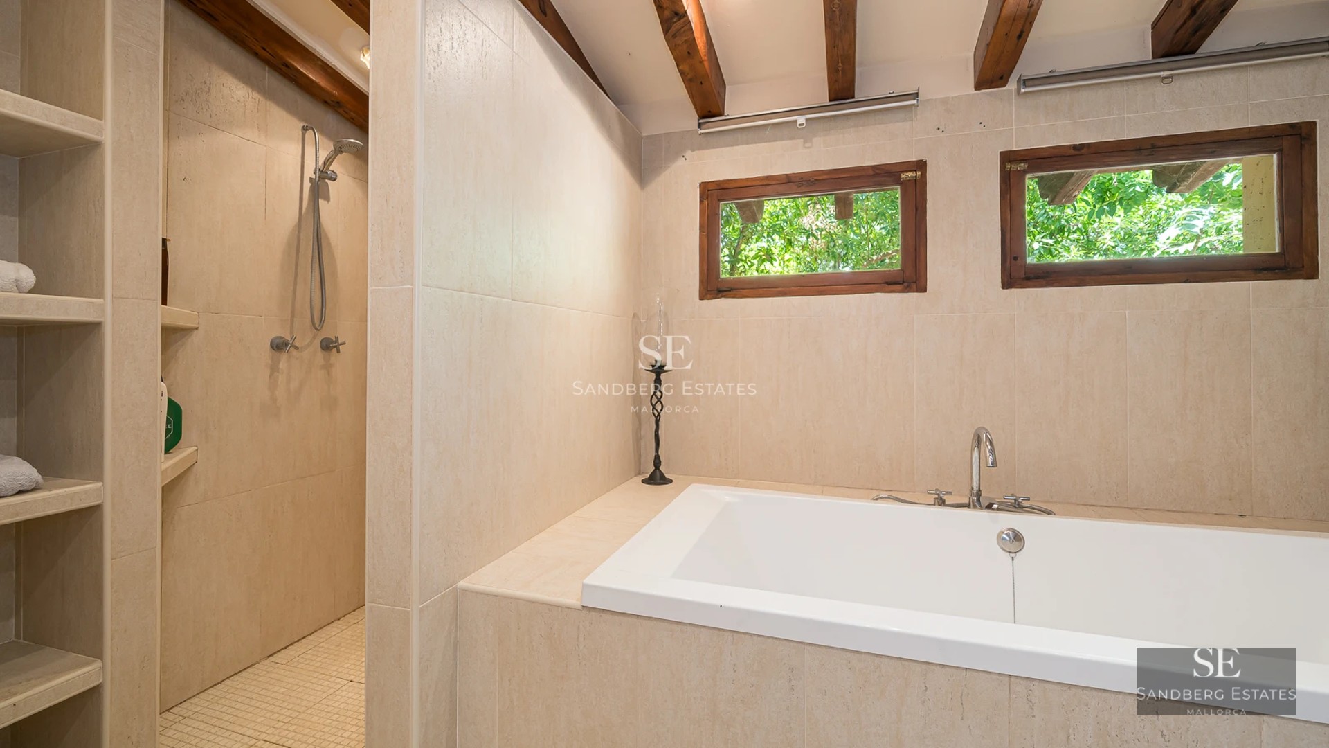 Expansive terrace featuring infinity pool. Ocean view. Modern design with sun loungers & umbrellas. Open spaces.