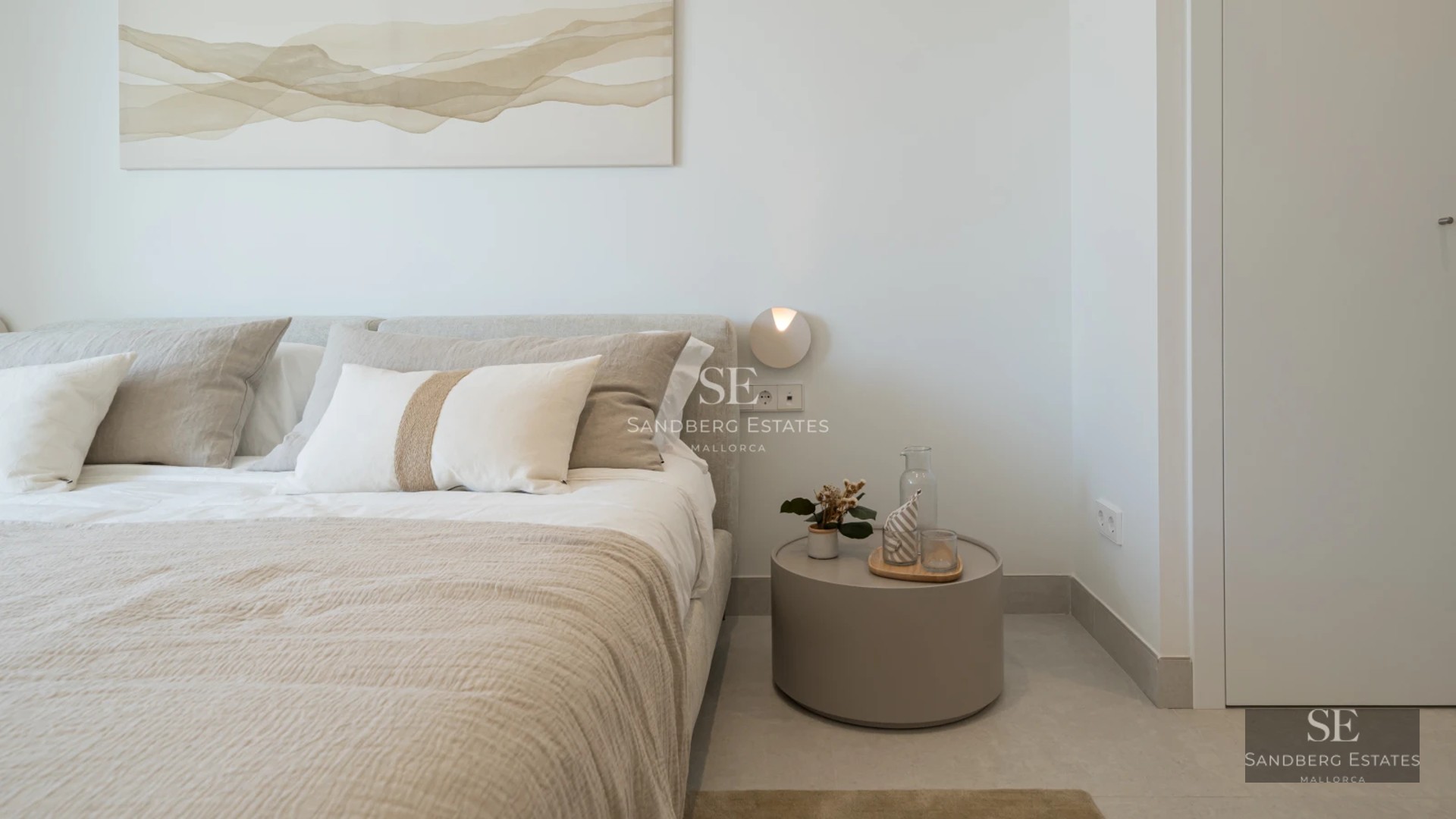 Aerial view of modern villa featuring an infinity pool, lush garden, and minimalist architecture. White facade and large windows.