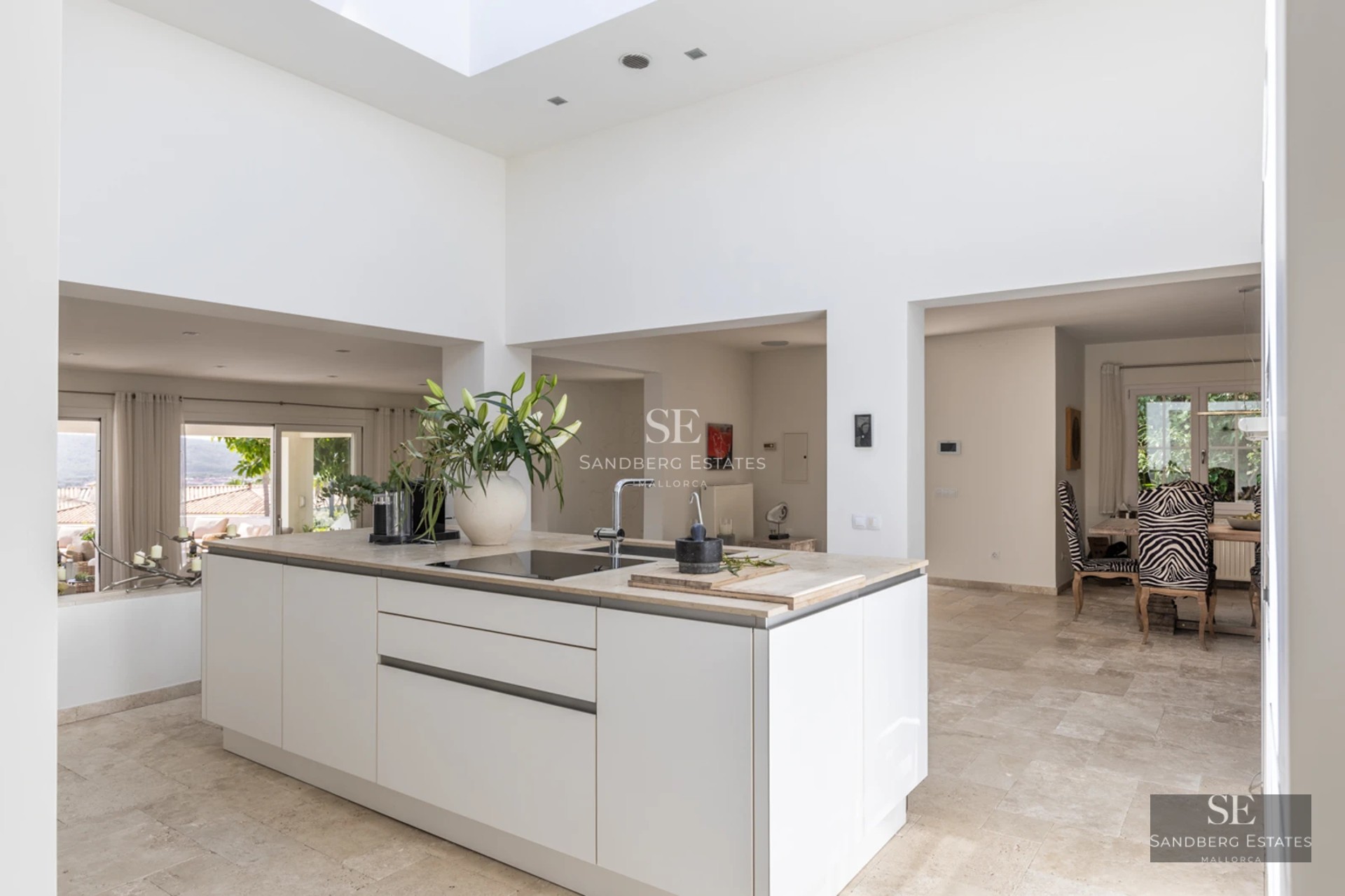 Exterior view of a luxurious house with a pool, large windows, modern design, and elegant landscaping. Ideal for relaxation.