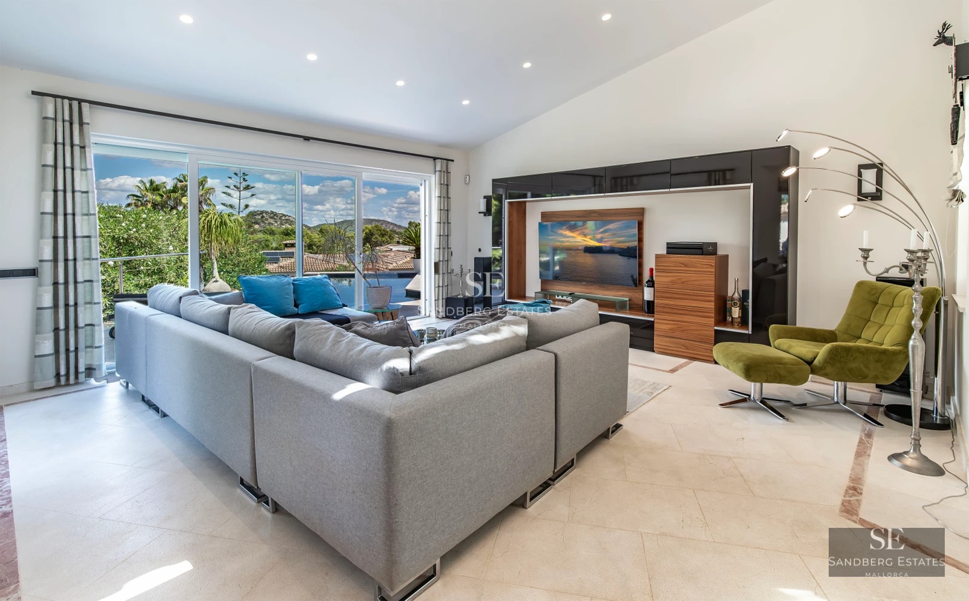 Expansive terrace with infinity pool, sun loungers, and panoramic views. Modern design with clean lines and abundant natural light.