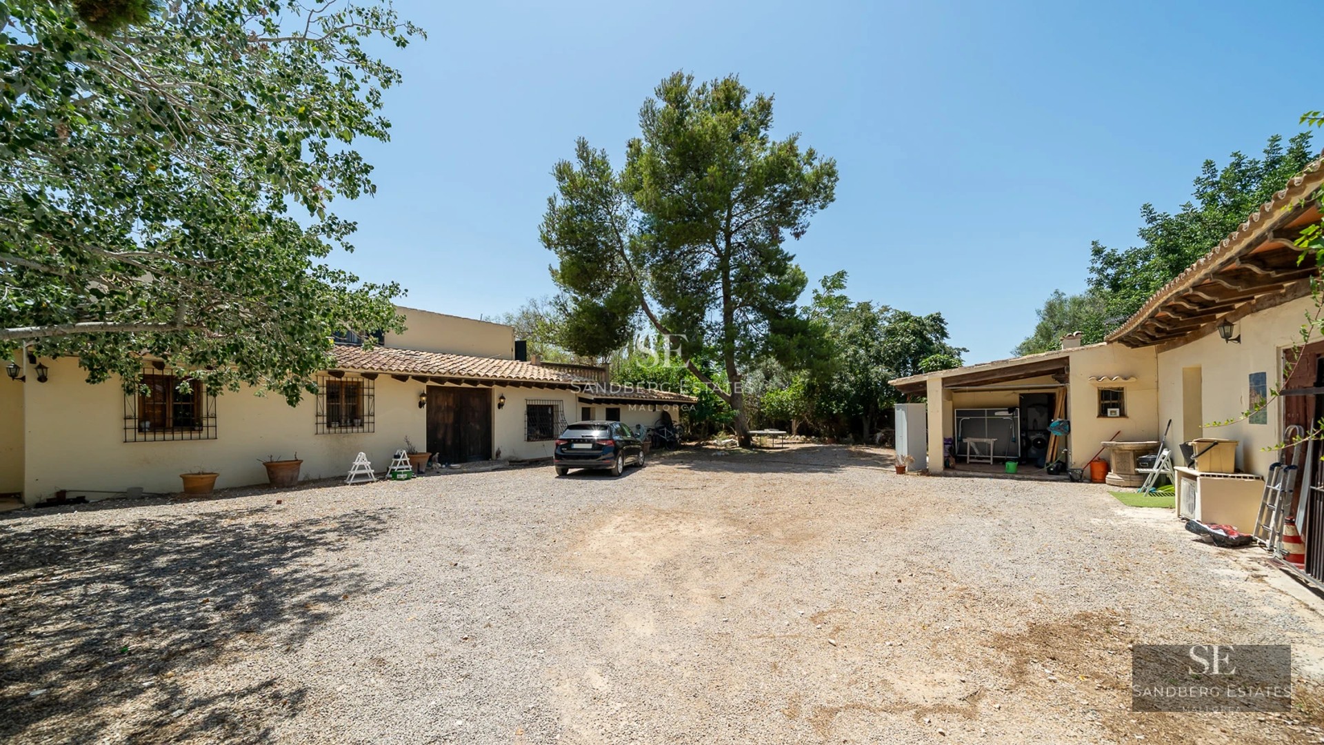 Expansive terrace featuring an infinity pool, sun loungers, and panoramic sea views. Modern and minimalist architecture.