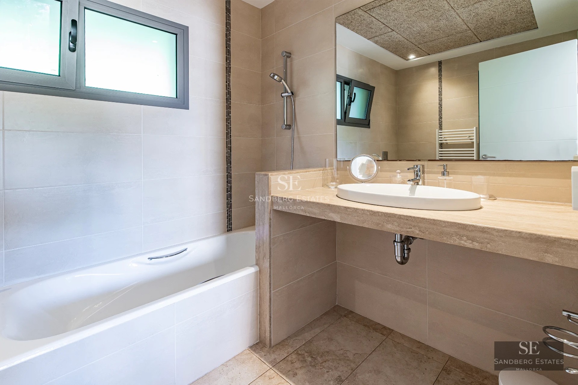 Spacious terrace with infinity pool and ocean views. Modern design with elegant furniture and lush greenery.