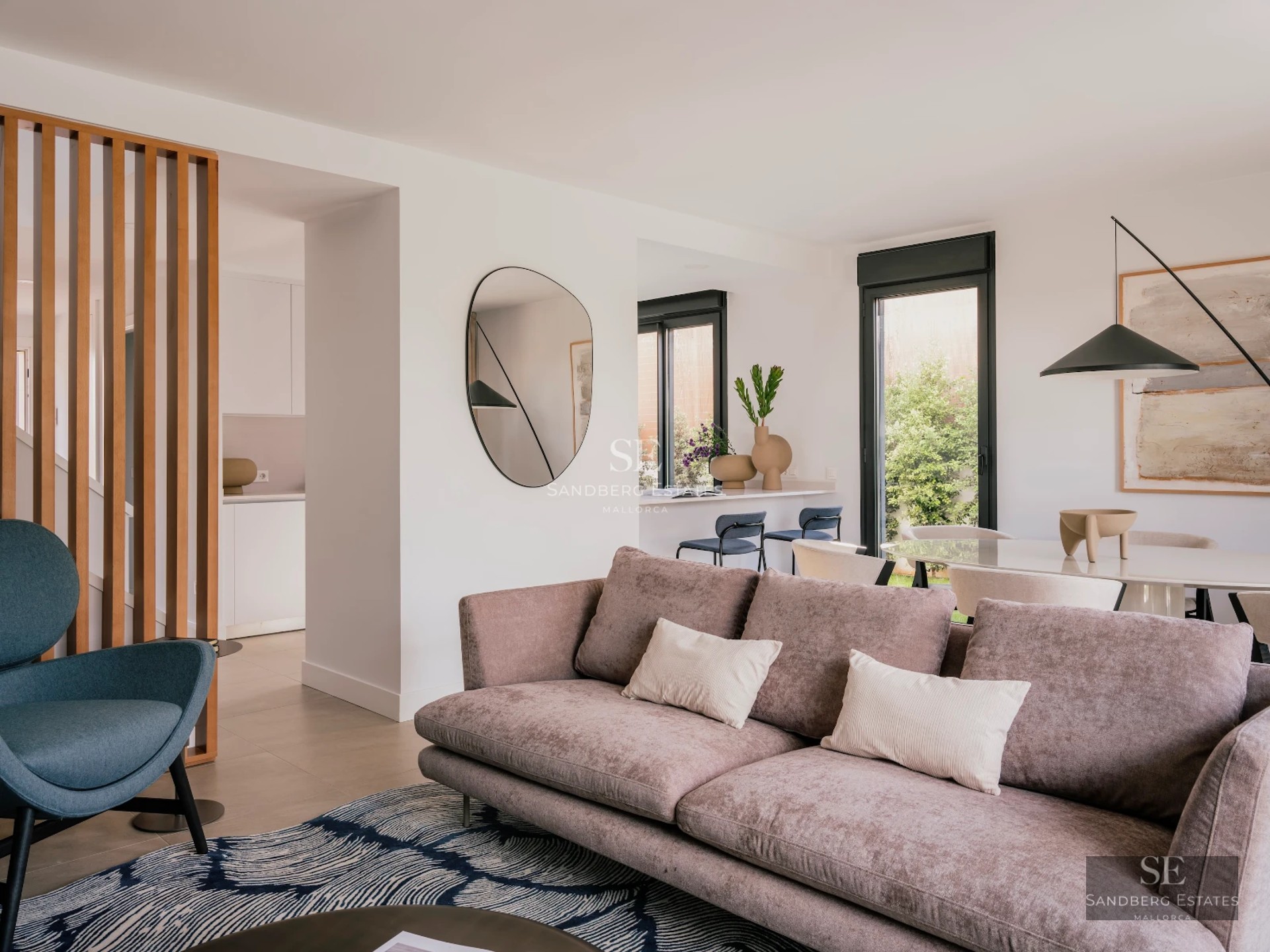 Exterior view of a modern villa featuring an infinity pool, lush garden, and spacious terraces. Contemporary and elegant architecture.