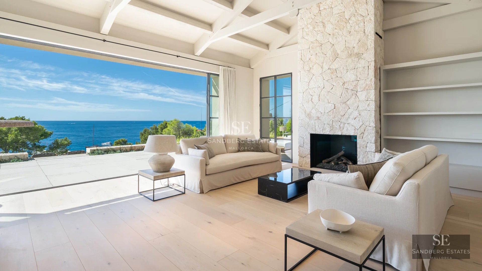 Exterior of modern villa with infinity pool. Minimalist architecture, large windows, manicured garden, sun loungers, and stylish umbrellas.