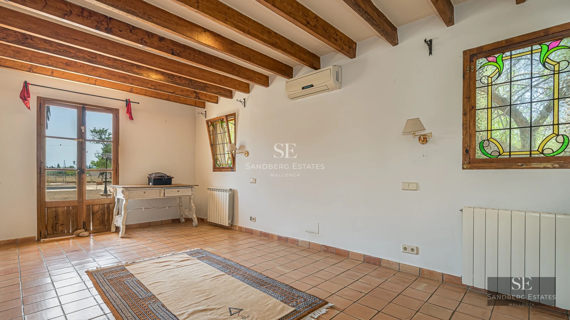 Spacious terrace featuring an infinity pool, ocean view, modern furniture, and lush vegetation. Contemporary architectural design.