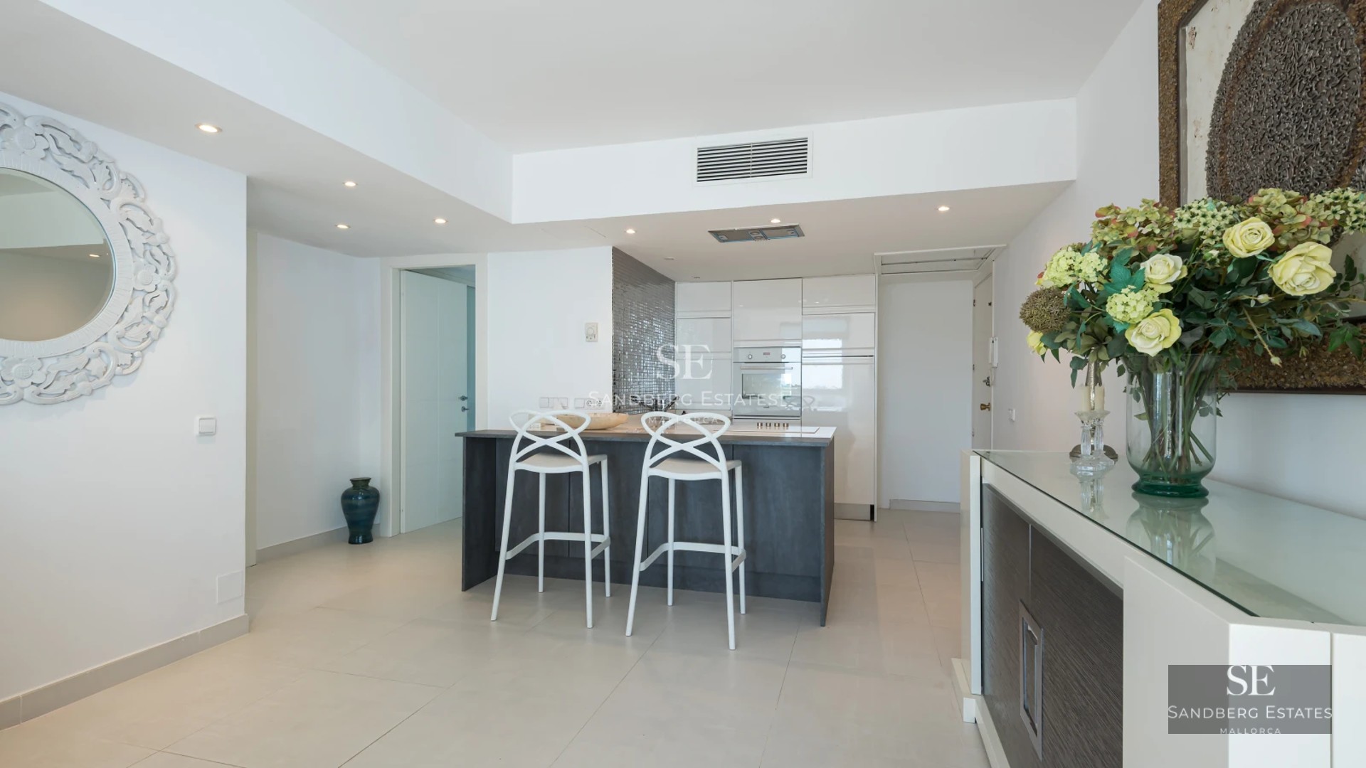 View of a luxurious villa with infinity pool, manicured garden, and modern architectural design. Soft ambient lighting.