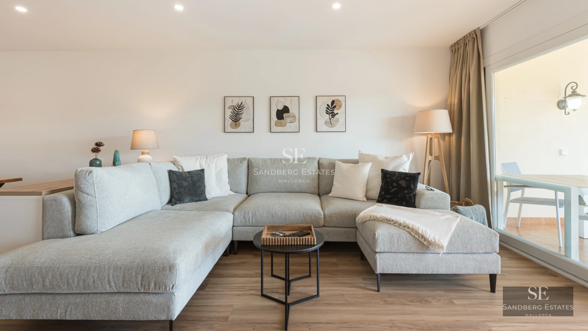 View of infinity pool surrounded by greenery and modern architecture with large windows and terrace. Luxury and outdoor design.