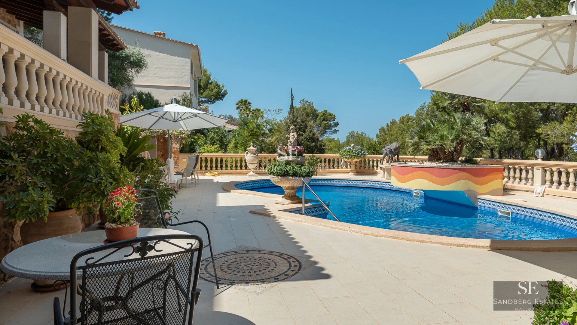 View of a modern home with a pool, lush garden, and minimalist architecture. Large windows and elegant design.