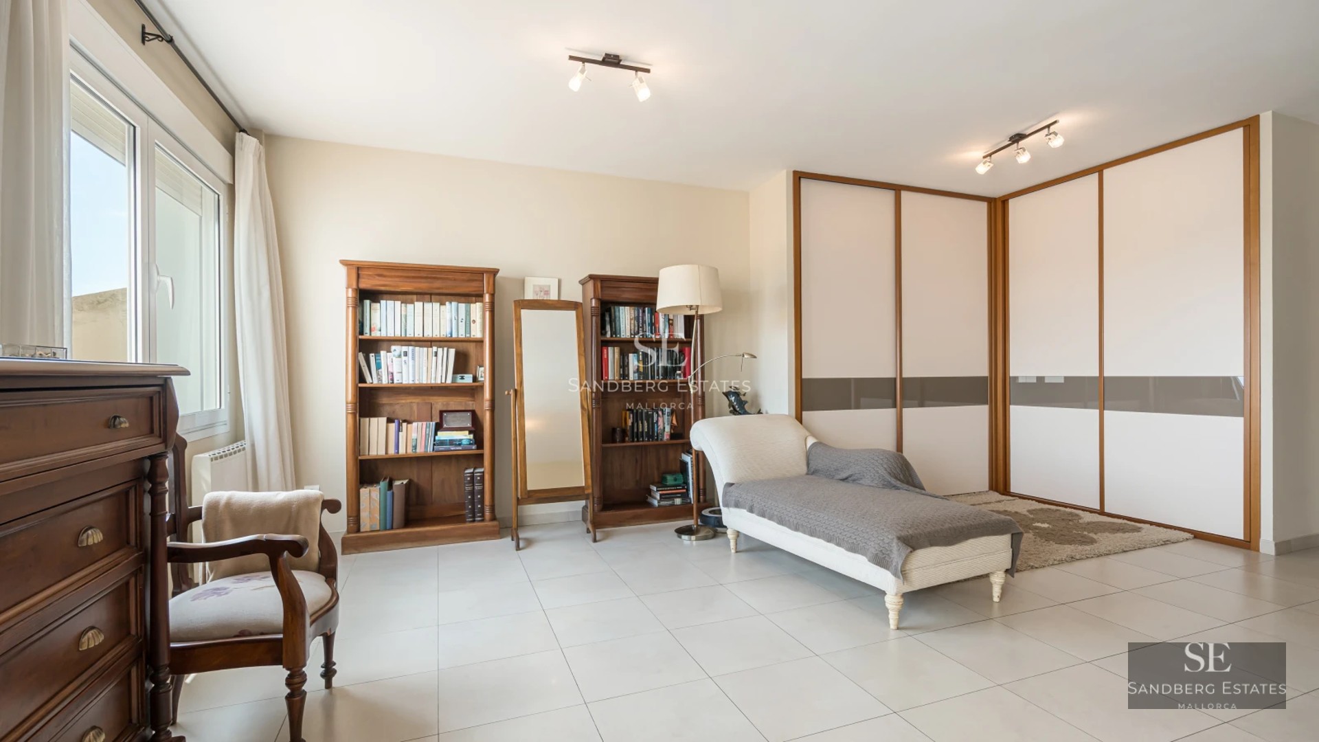 Exterior view of modern villa with infinity pool, large terraces, and minimalist architectural design. Warm lighting and lush landscaping.