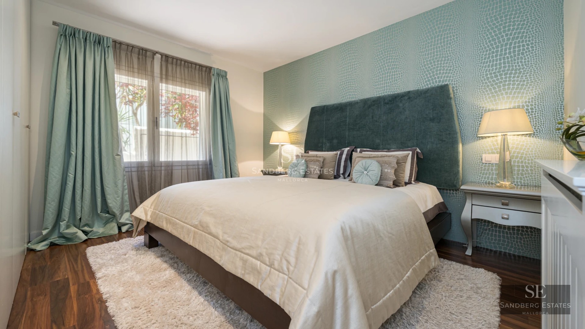 View of infinity pool and terrace of a modern villa with lounge chairs and panoramic views. Elegant design with ambient lighting.