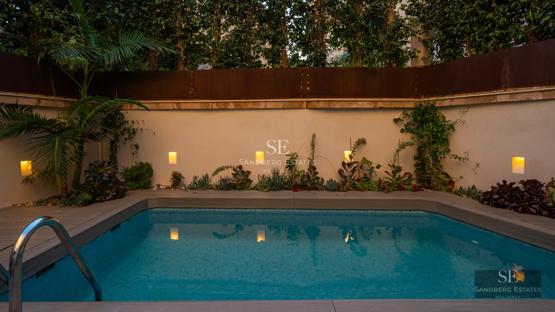 Exterior view of a modern villa with a pool, large windows, and minimalist design. Lush landscape. Soft sunset lighting.