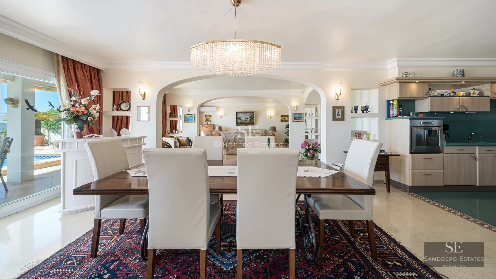 Exterior view of a modern villa with a pool, manicured garden and large terraces. Minimalist and elegant architecture.