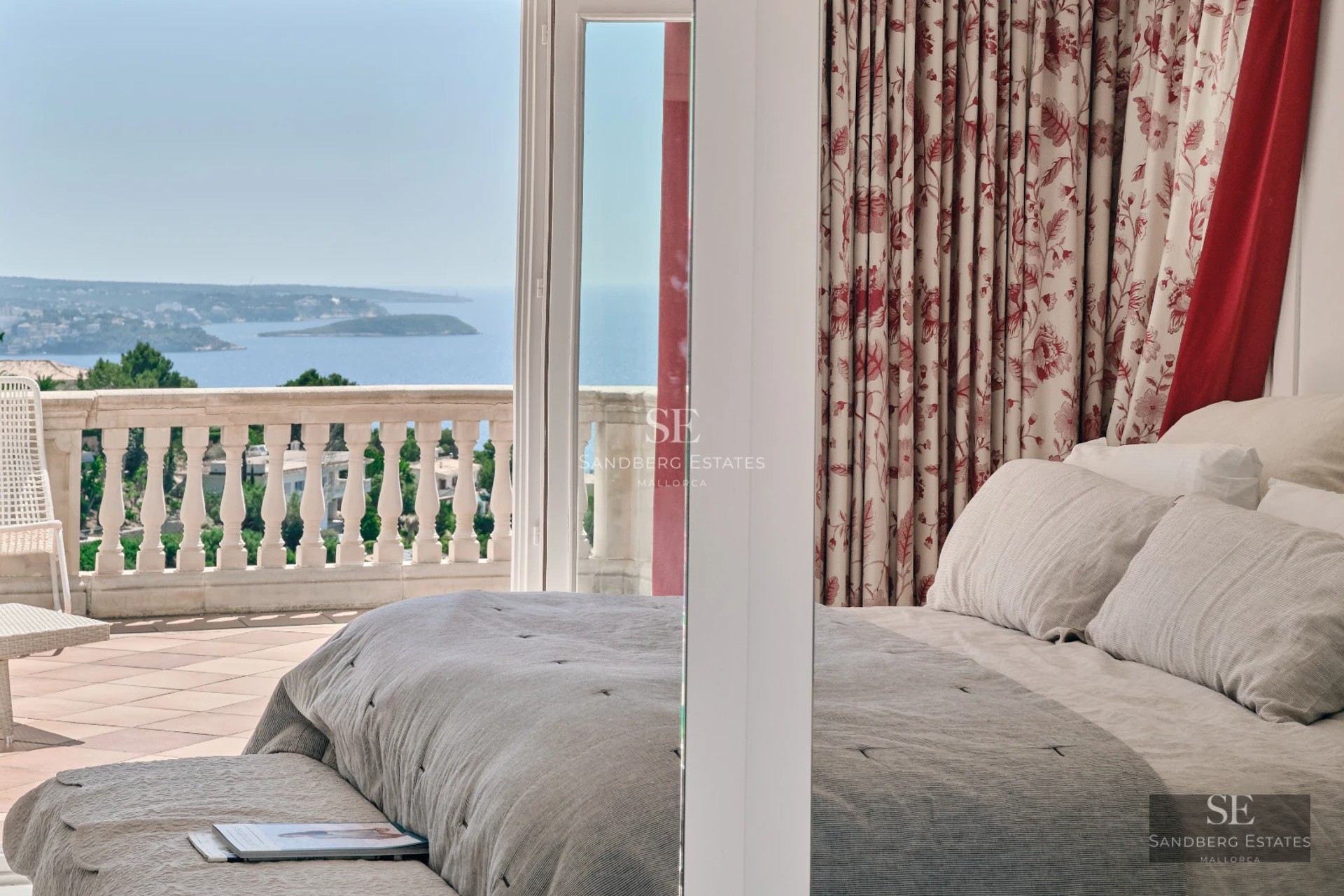 Spacious balcony with ocean views. Modern and elegant furniture. Seamless indoor-outdoor living. Abundant natural light.