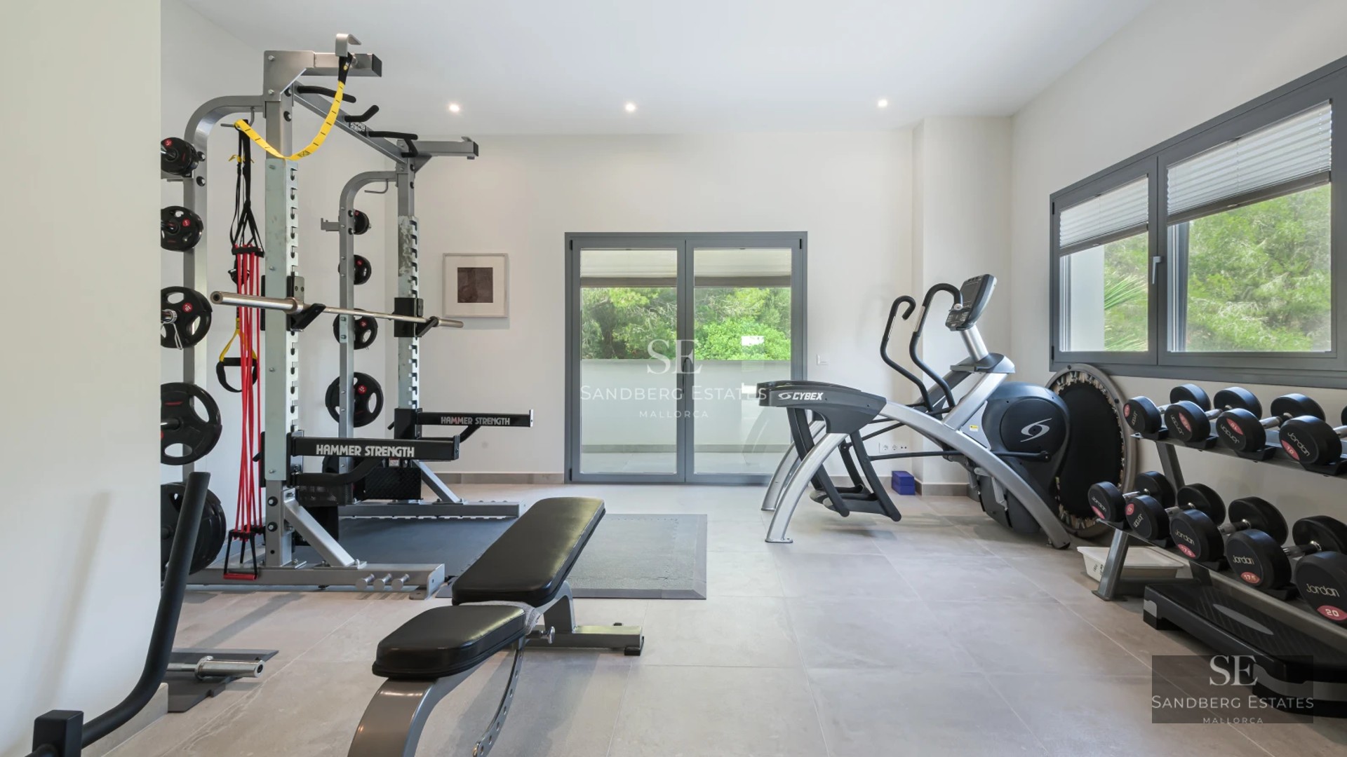 Exterior of a modern villa with an infinity pool, lush garden, and spacious terraces. Minimalist architectural design with panoramic windows.