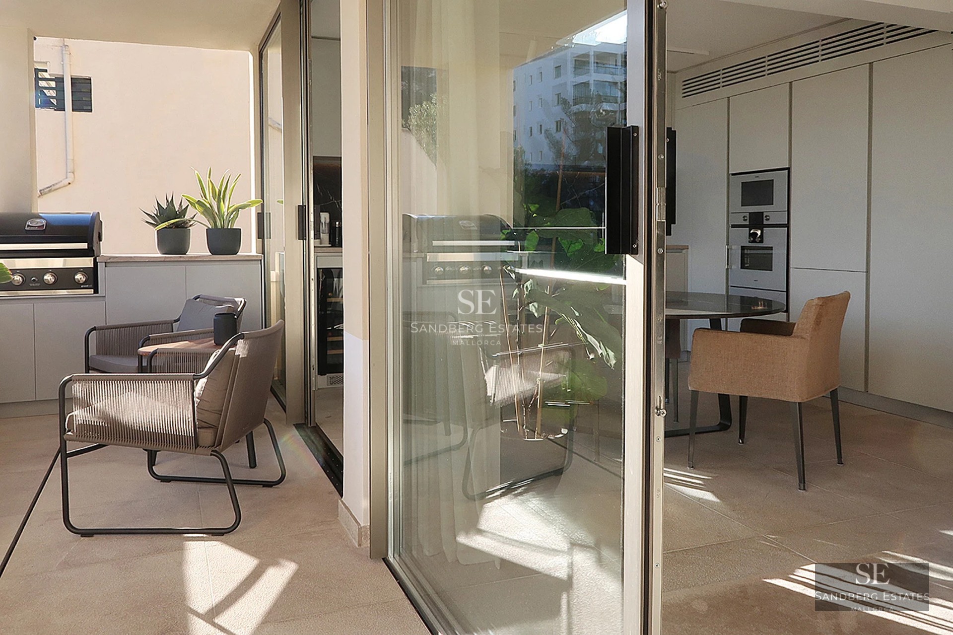 Aerial view of a modern villa with infinity pool, surrounded by lush gardens. Contemporary design and luxury finishes.