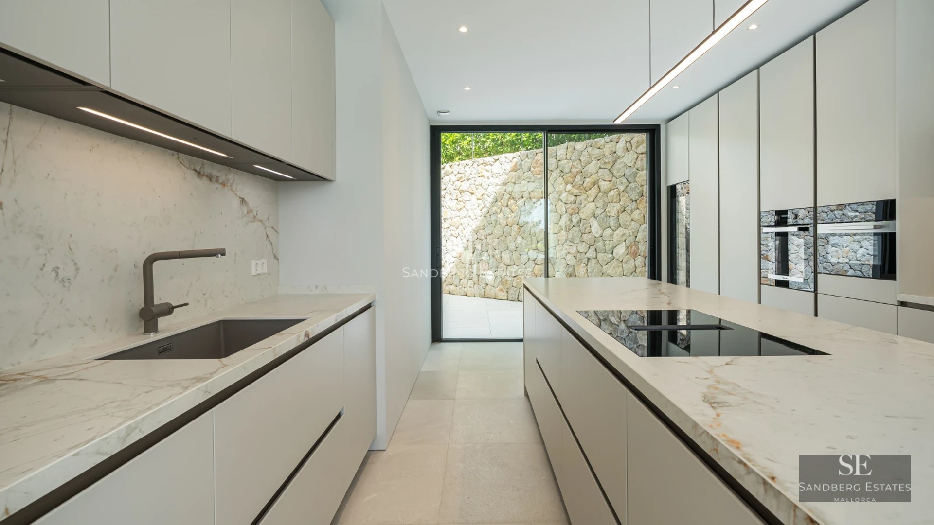 Spacious terrace with pool, sun loungers, and garden views. Modern, elegant, and bright architecture. Ideal for enjoying the outdoors.