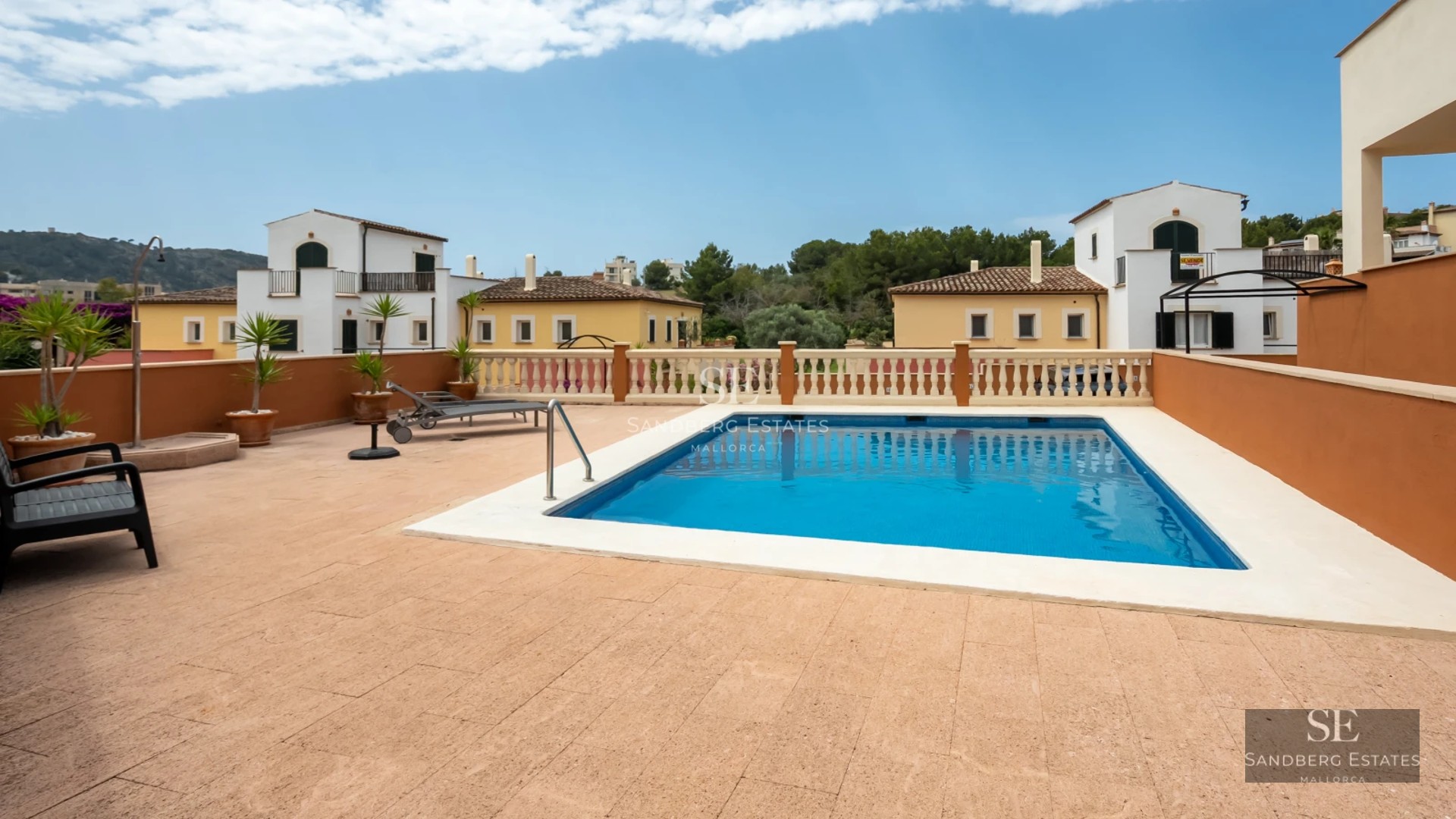 View of a modern villa with a pool, surrounded by greenery. Elegant architecture and contemporary design.