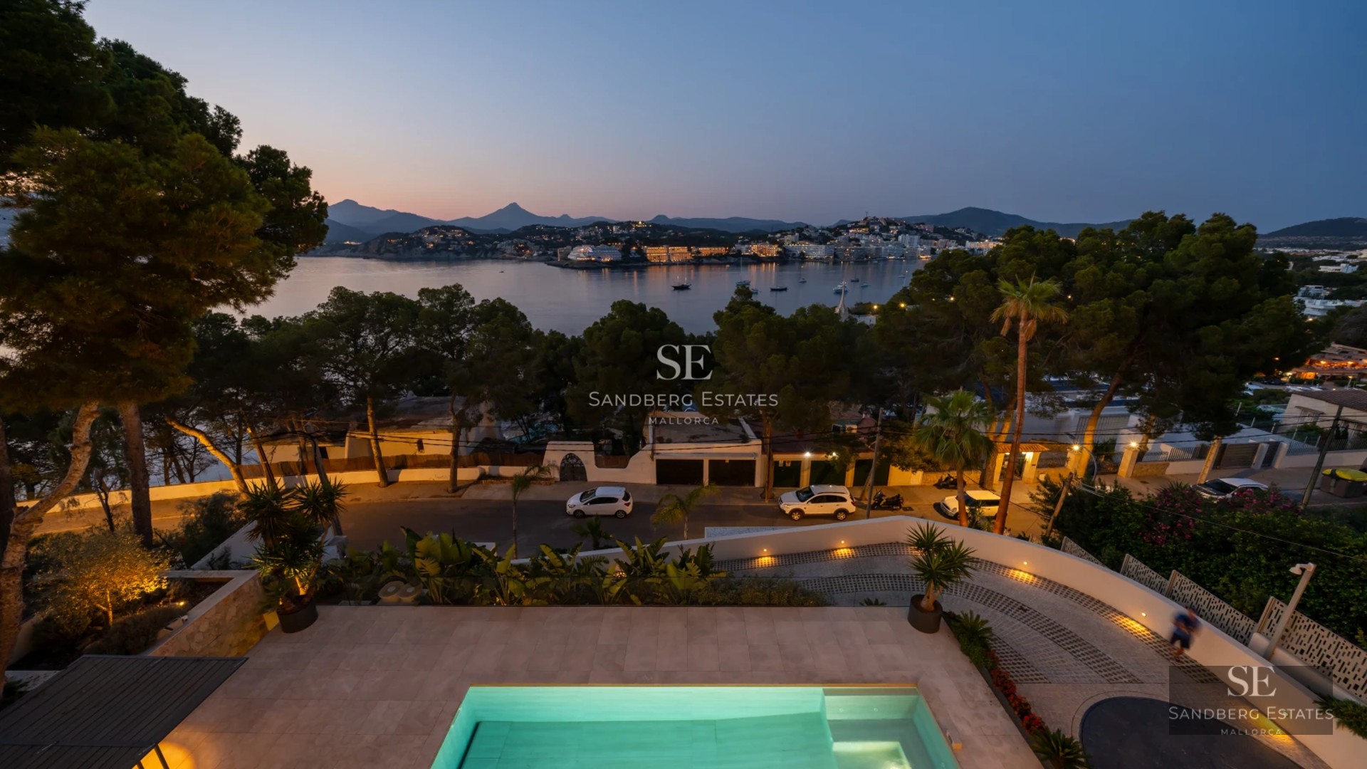 Exterior of a modern villa with infinity pool, expansive terraces, and lush gardens. Minimalist design and panoramic sea views.