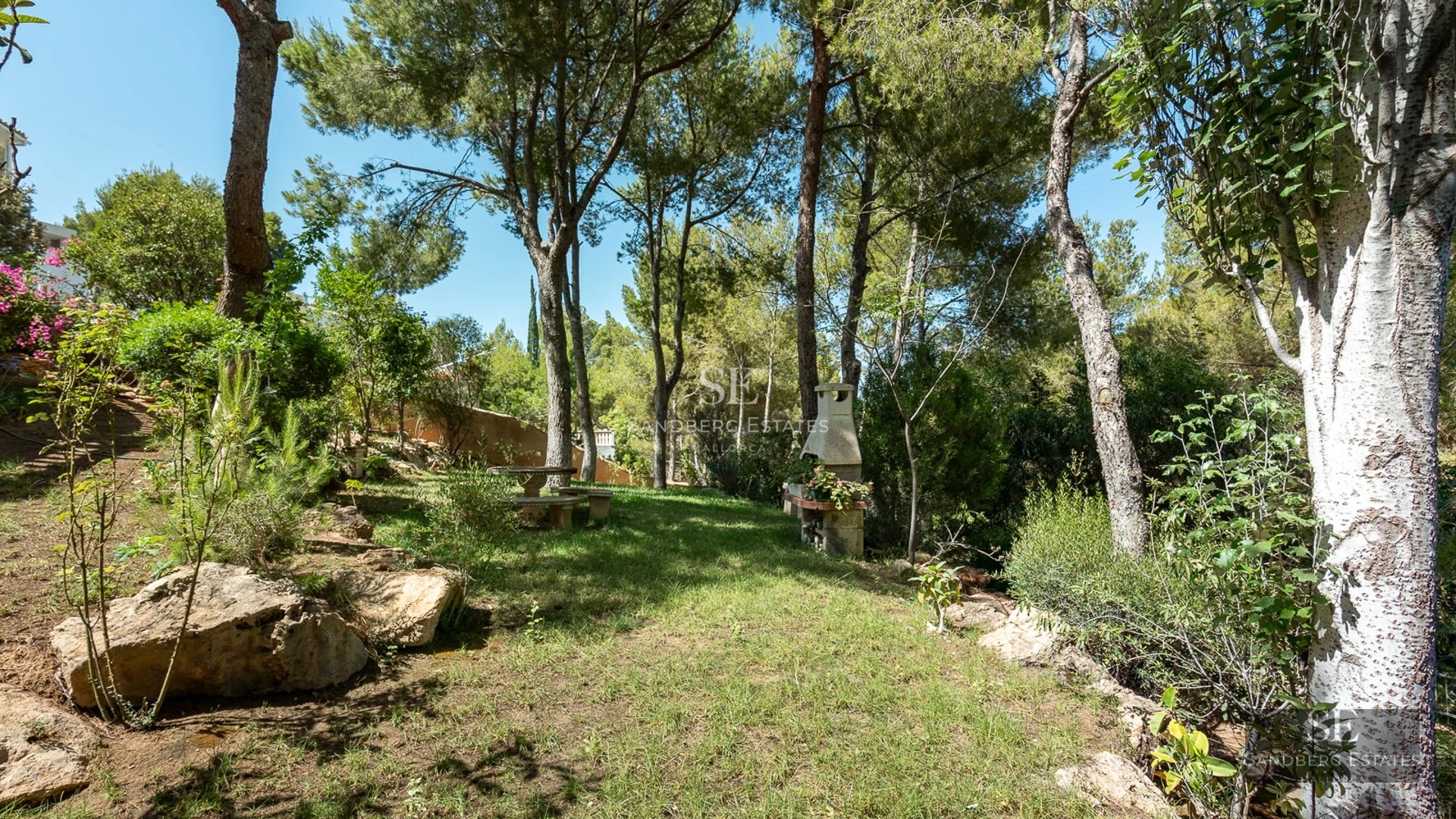 Expansive terrace with infinity pool, modern furnishings, and panoramic views. Elegant architecture with high-quality finishes.