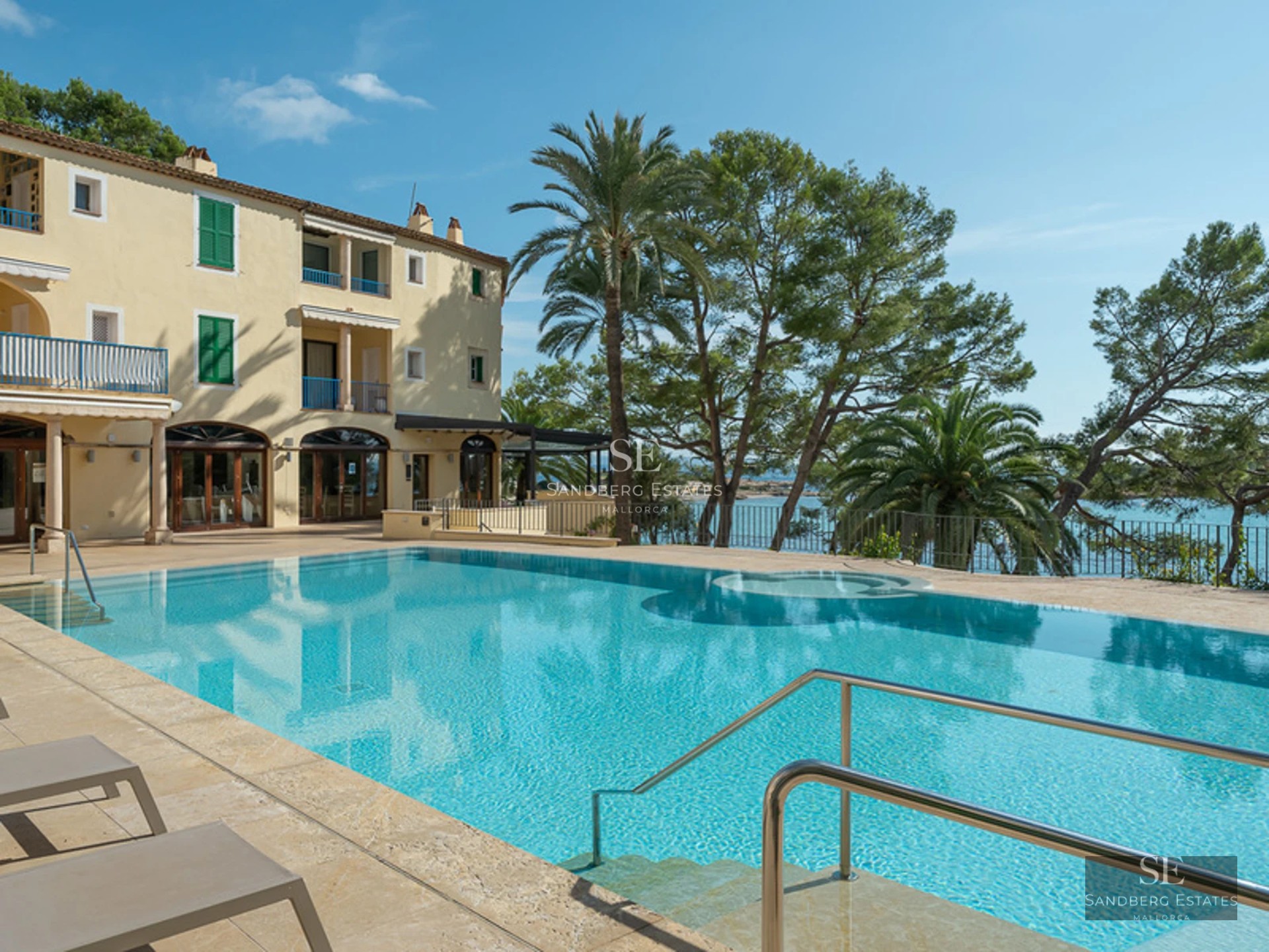 Aerial view of modern villa with pool, garden, and terrace. Minimalist architecture, large windows, and ambient lighting.