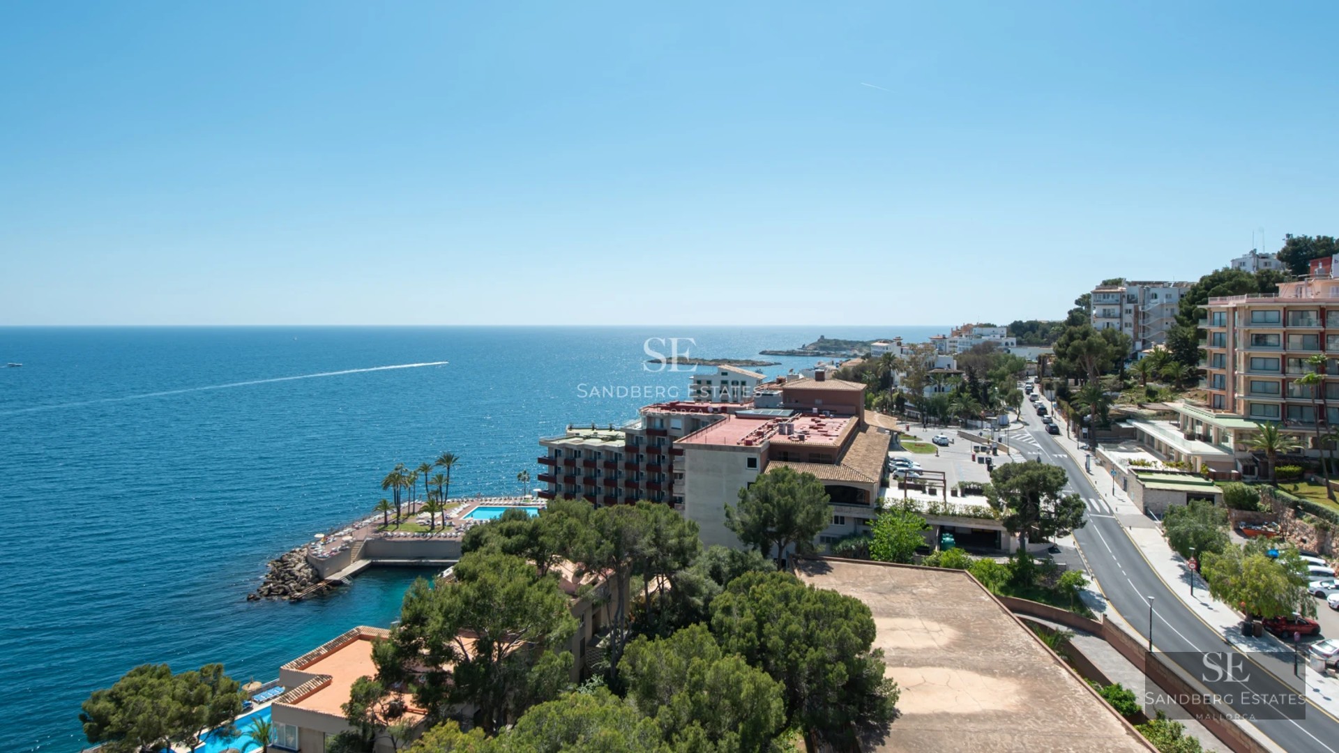 Panoramic view of a modern house with infinity pool and spacious terraces. Minimalist design, neutral colors, and abundant natural light.