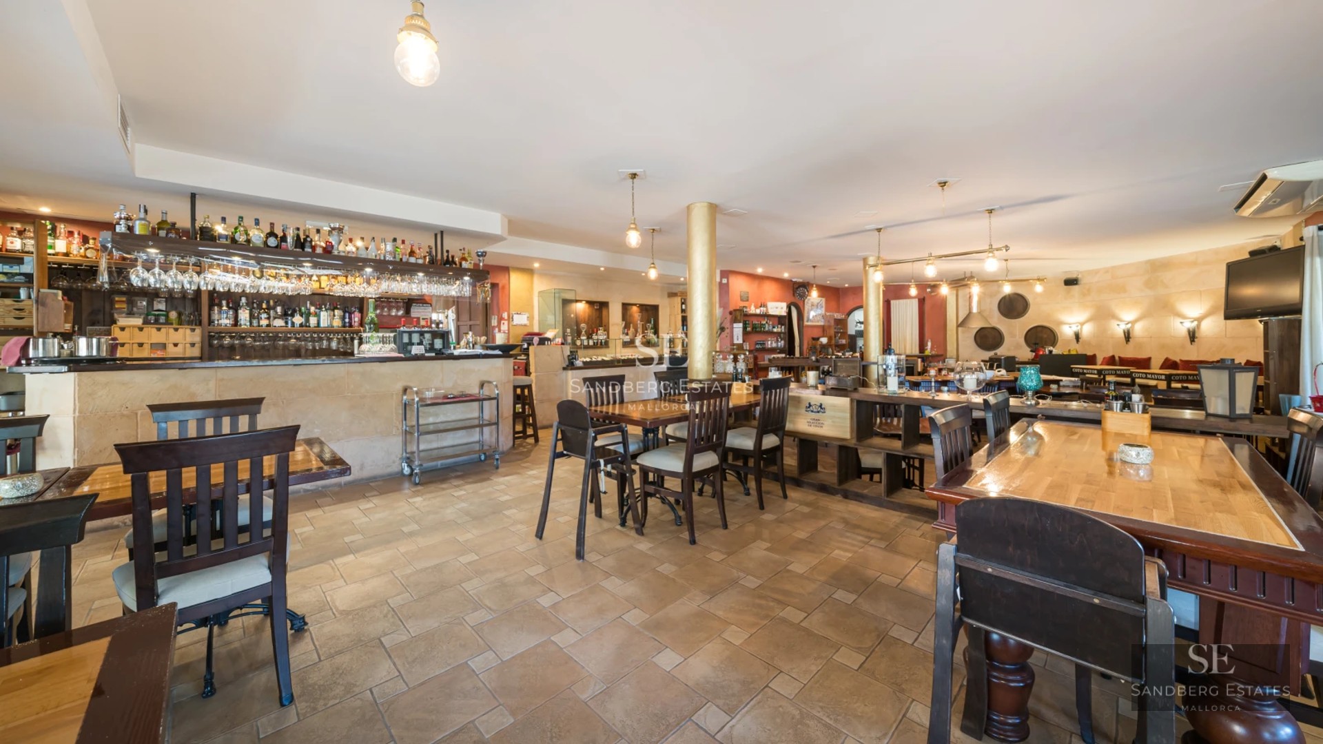 Expansive terrace featuring an infinity pool, sun loungers, and panoramic ocean views. Modern and elegant architecture.