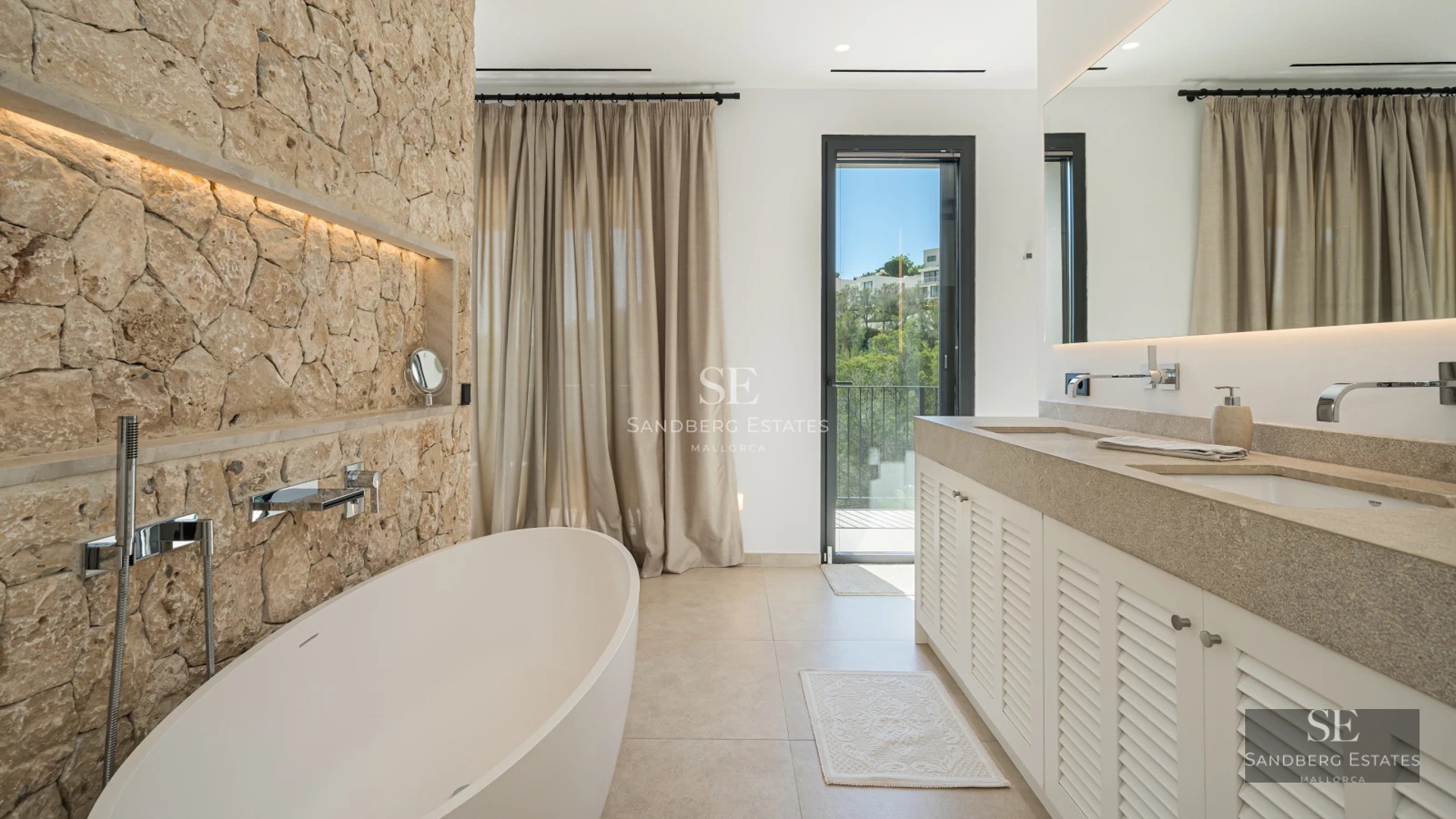 Exterior view of a modern villa with a pool, lush garden, and large windows maximizing natural light and views.