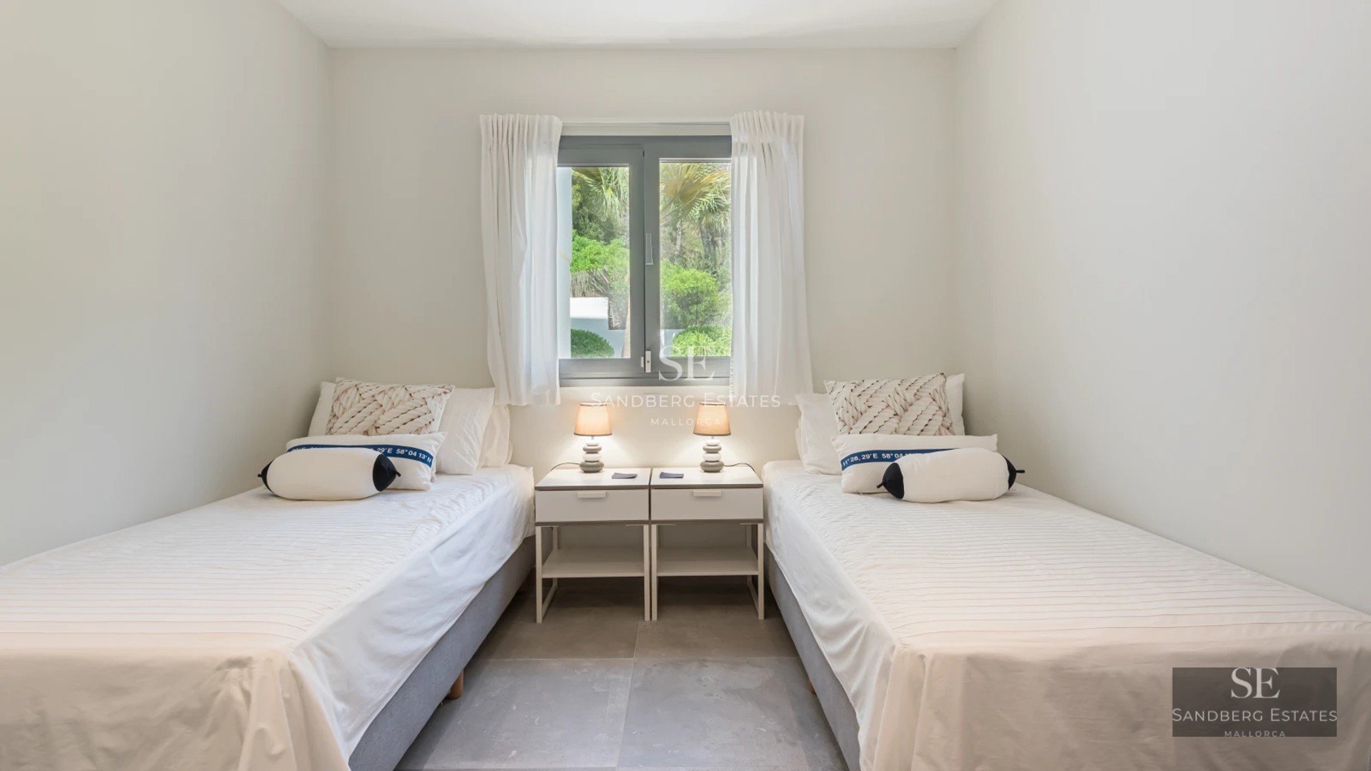 Exterior of modern villa featuring a shimmering pool, large windows, and lush landscaping. Soft ambient lighting.