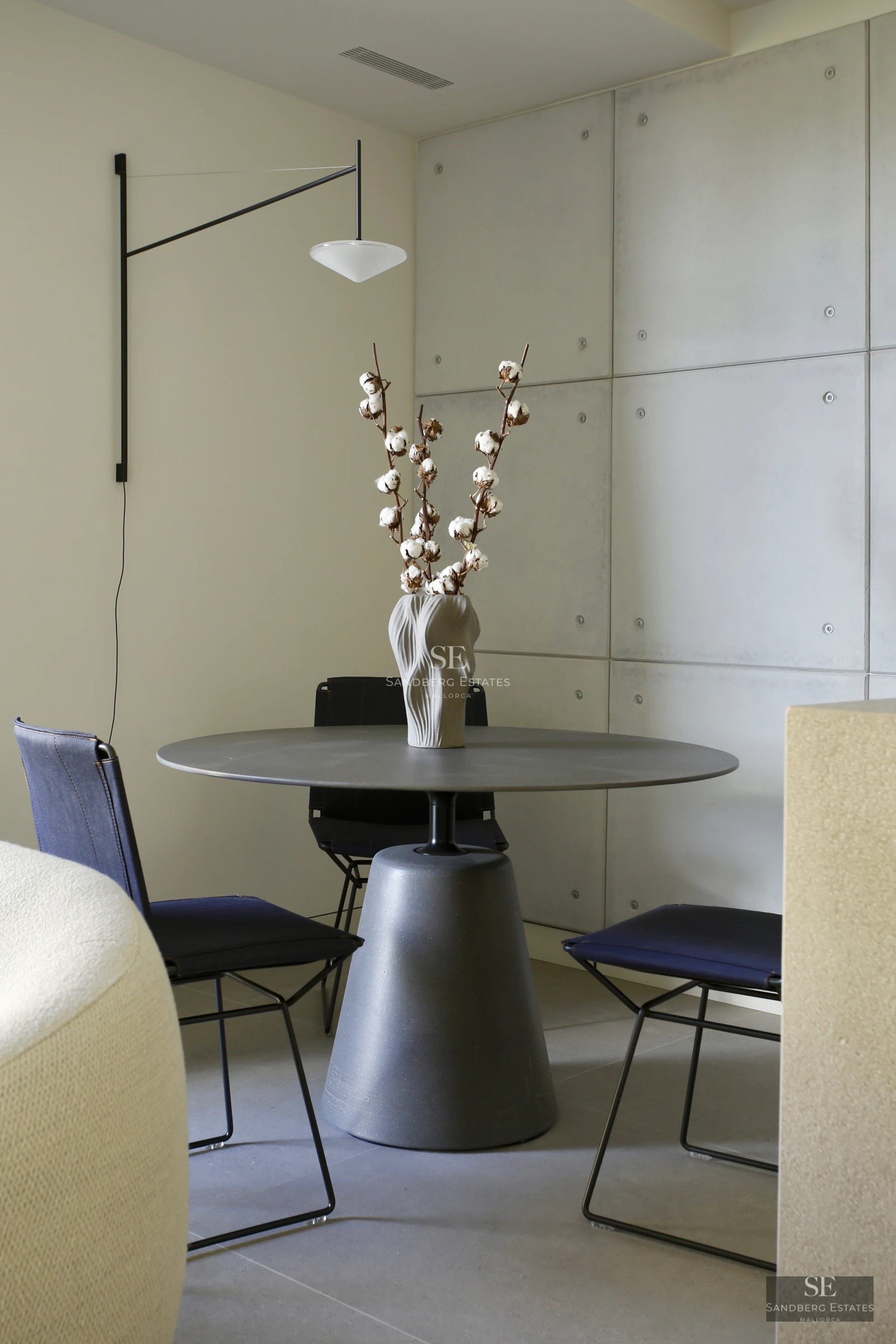 Bright living room featuring large windows, an infinity pool, and panoramic views. Modern design with hardwood floors and elegant furniture.