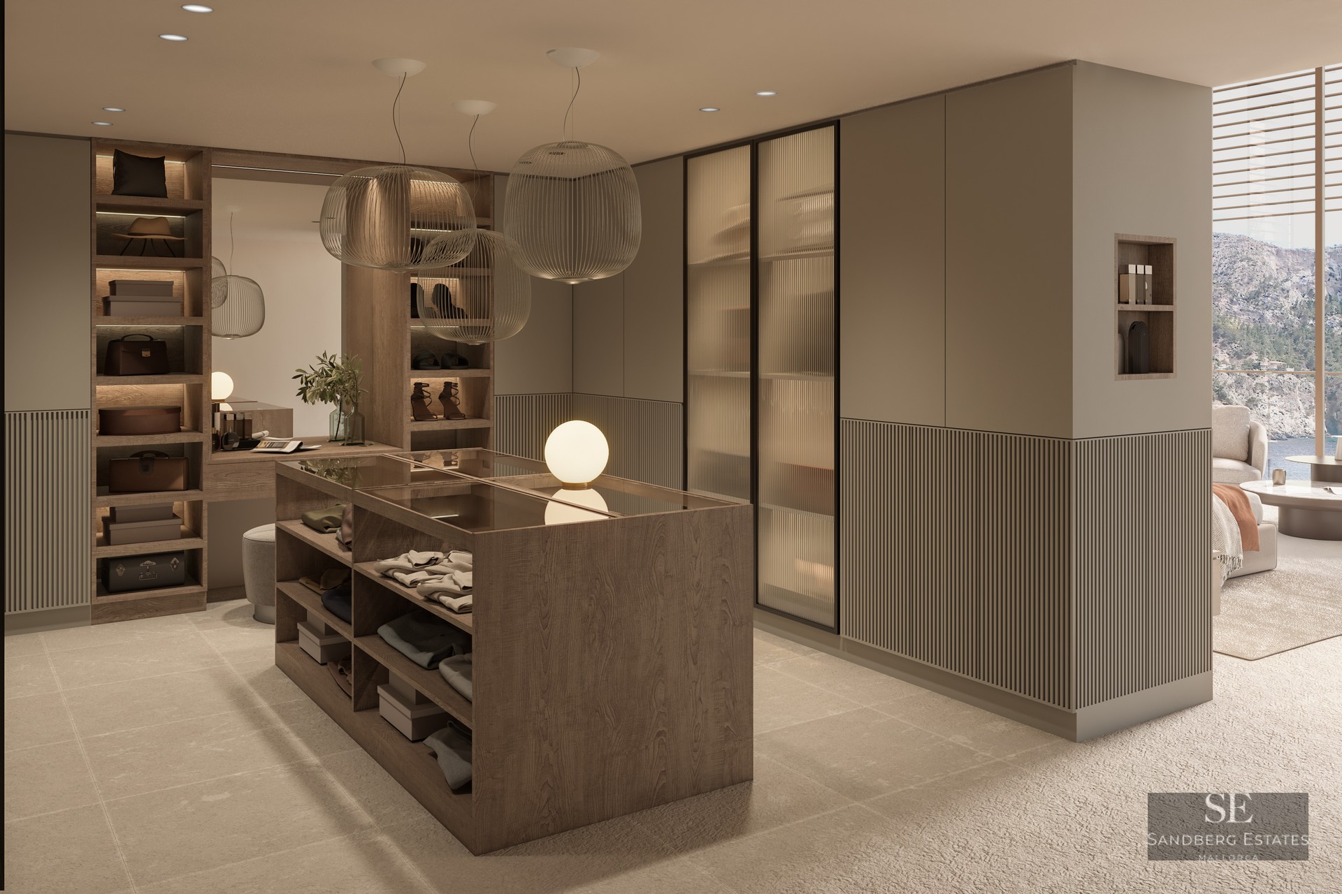 Modern dressing room featuring a central wood island, ribbed glass wardrobes, and elegant sphere pendant lights.