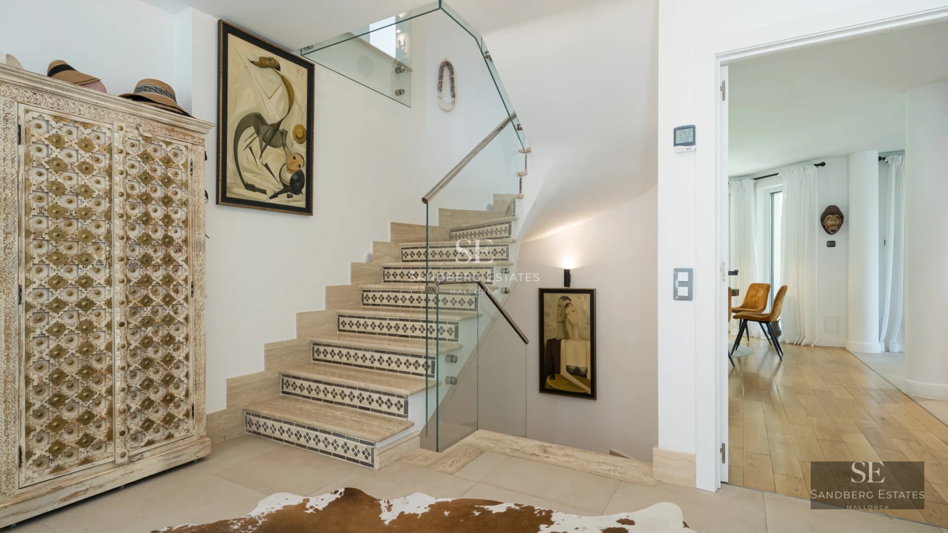 Exterior view of a modern villa featuring a swimming pool, lush garden, large windows, and designer architecture. Natural lighting.