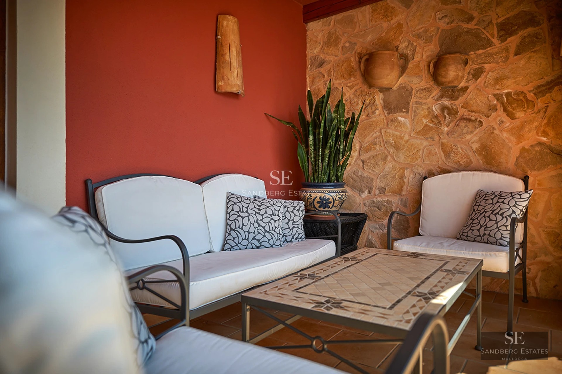Panoramic view of a villa with an infinity pool, lush garden, and modern architecture. Large windows illuminate the spaces.