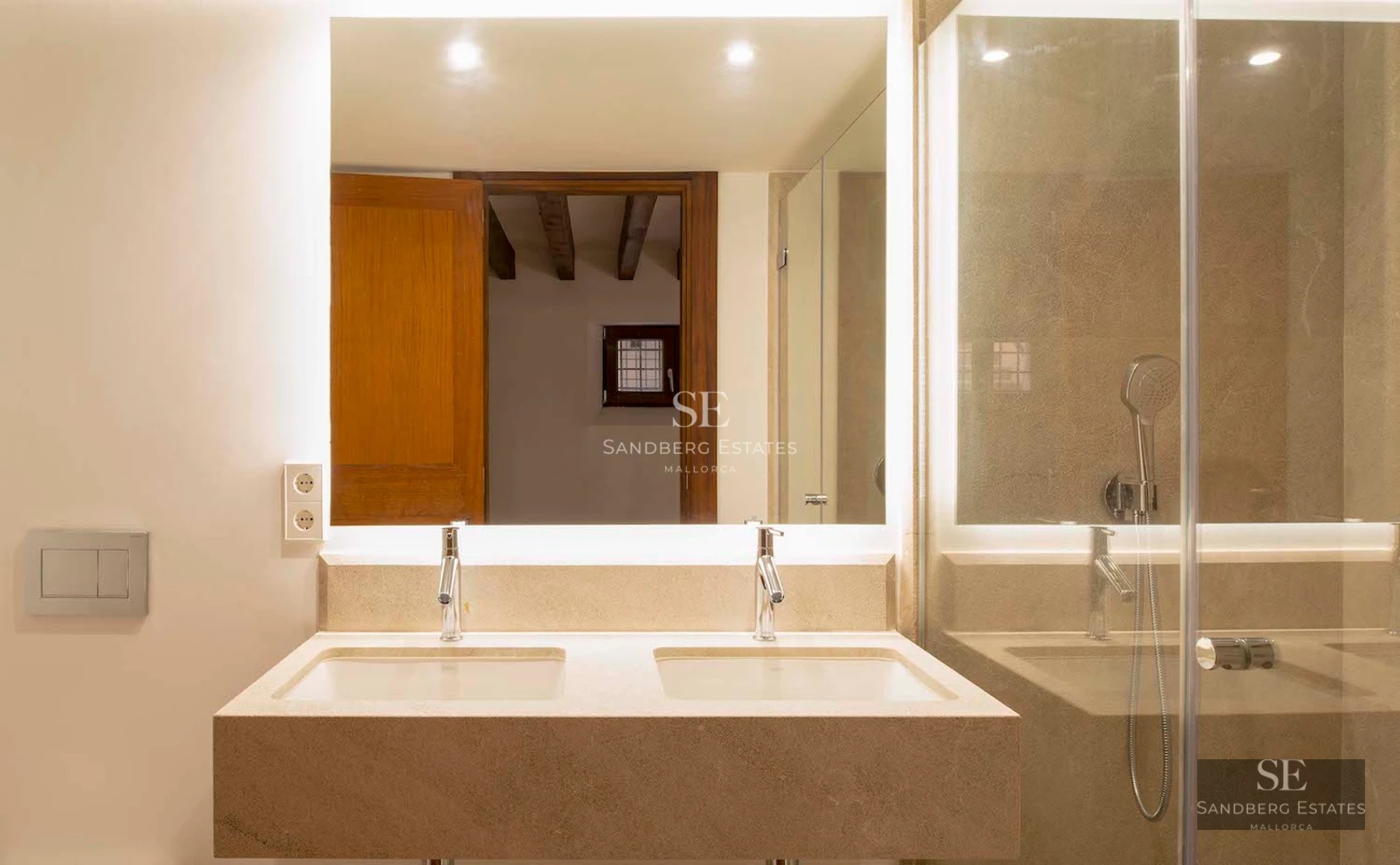 Spacious terrace with infinity pool, ocean views, modern furniture, and lush vegetation. Soft lighting and relaxing ambiance.