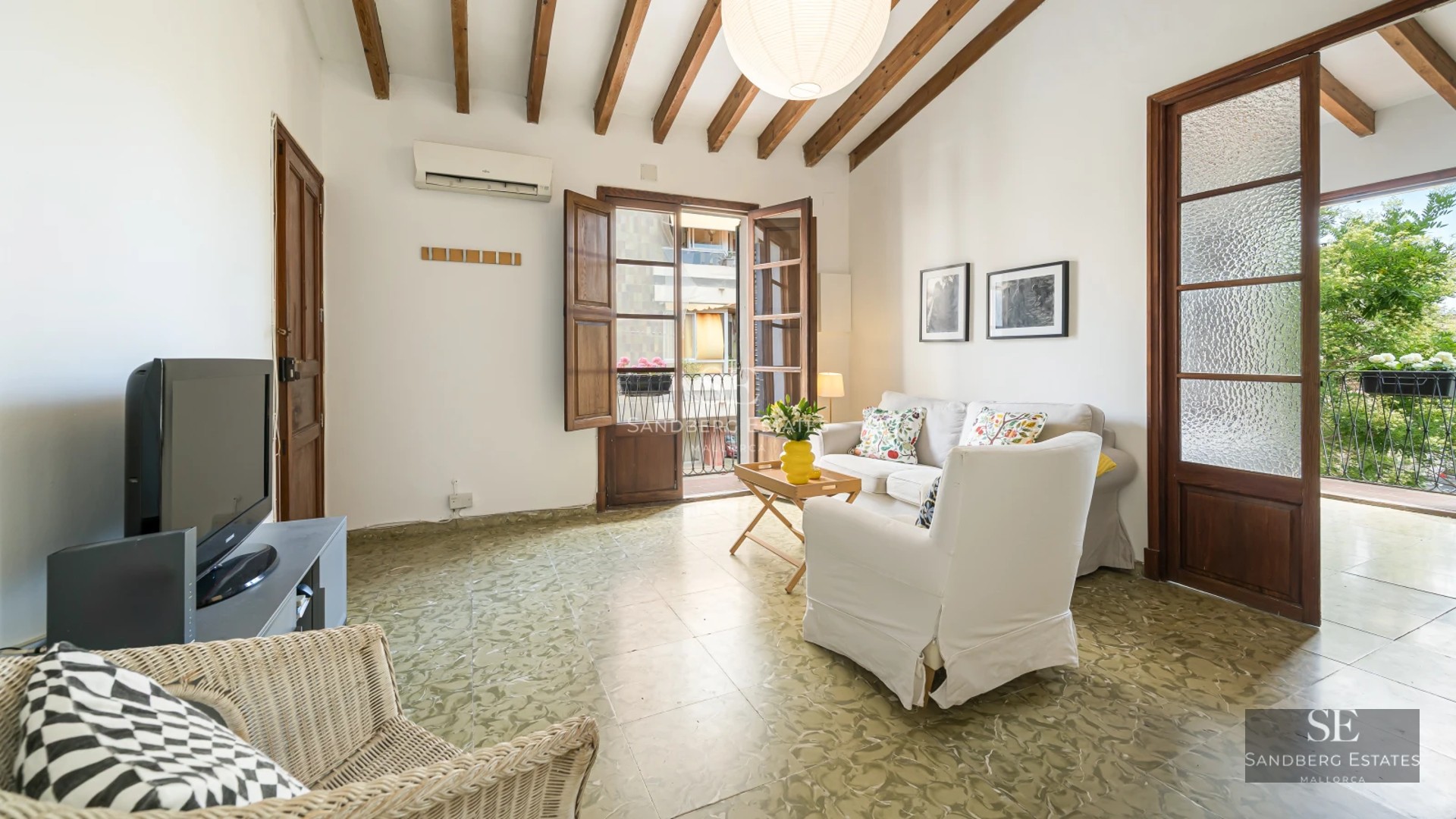 View of a modern villa with a pool, minimalist architecture, and large windows overlooking a lush garden.