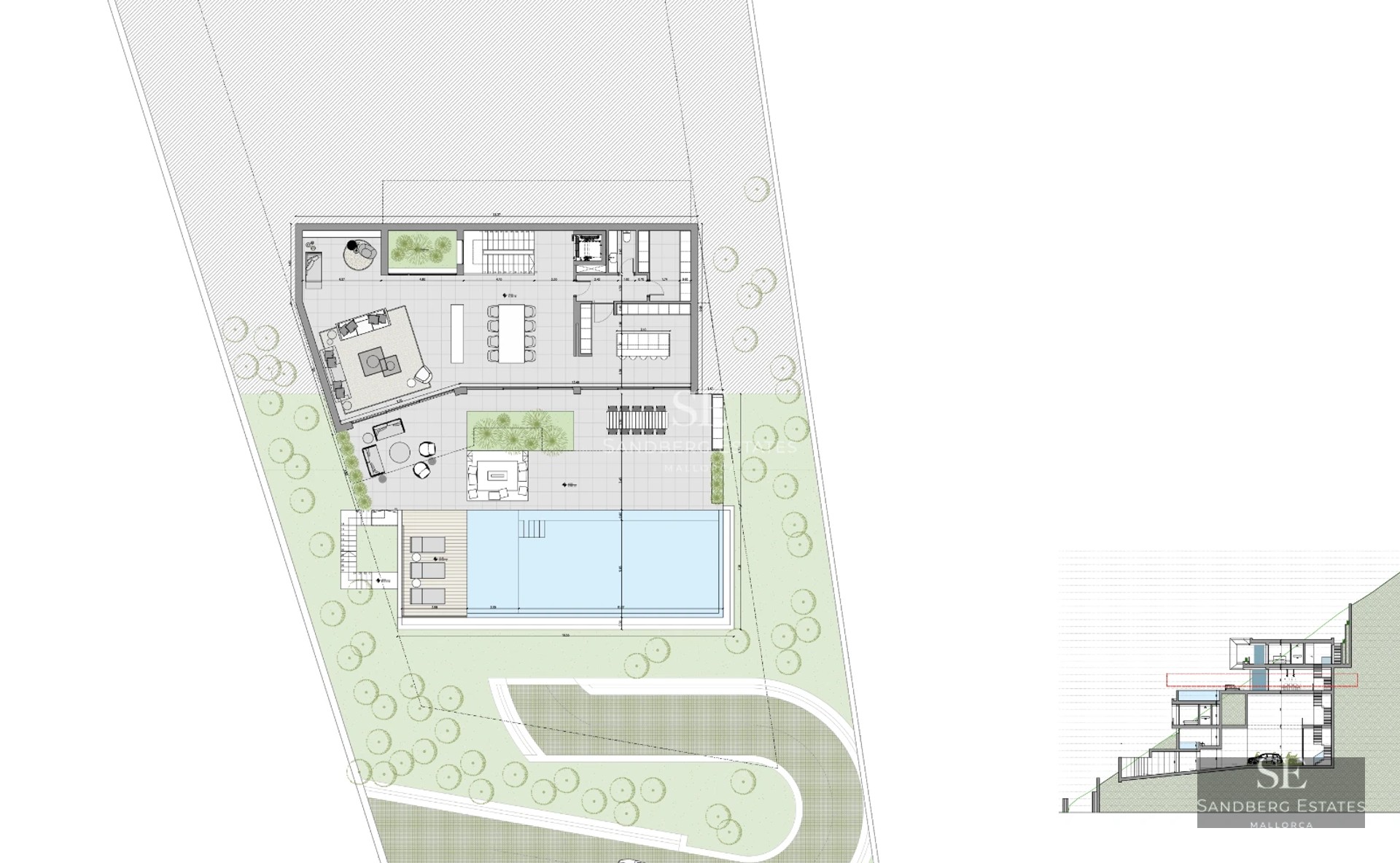 View of infinity pool surrounded by lush greenery. Modern architecture with large glass windows and landscape design.