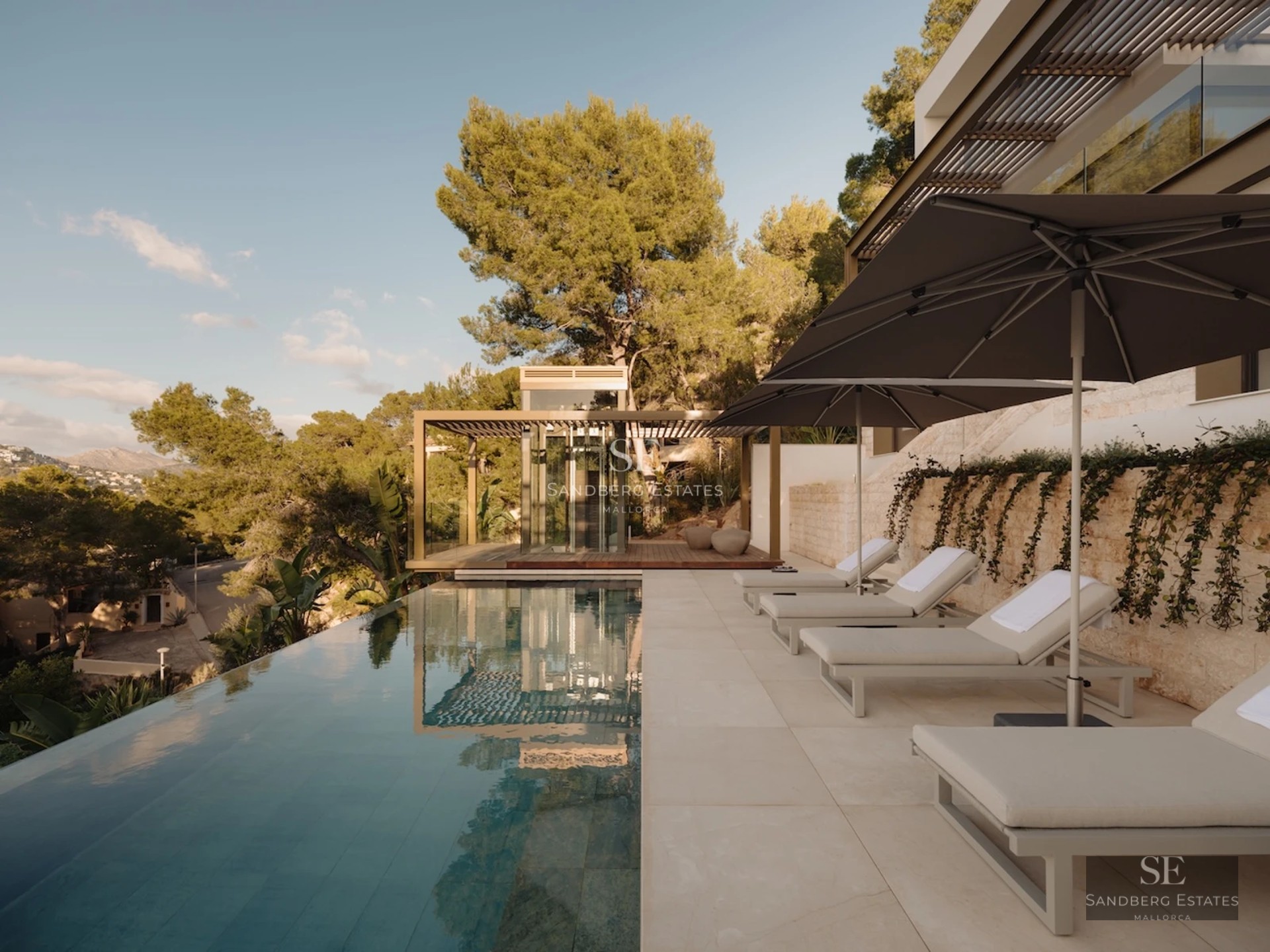 Minimalist exterior featuring infinity pool, spacious terraces, lush greenery, and panoramic ocean views. Contemporary, elegant design.