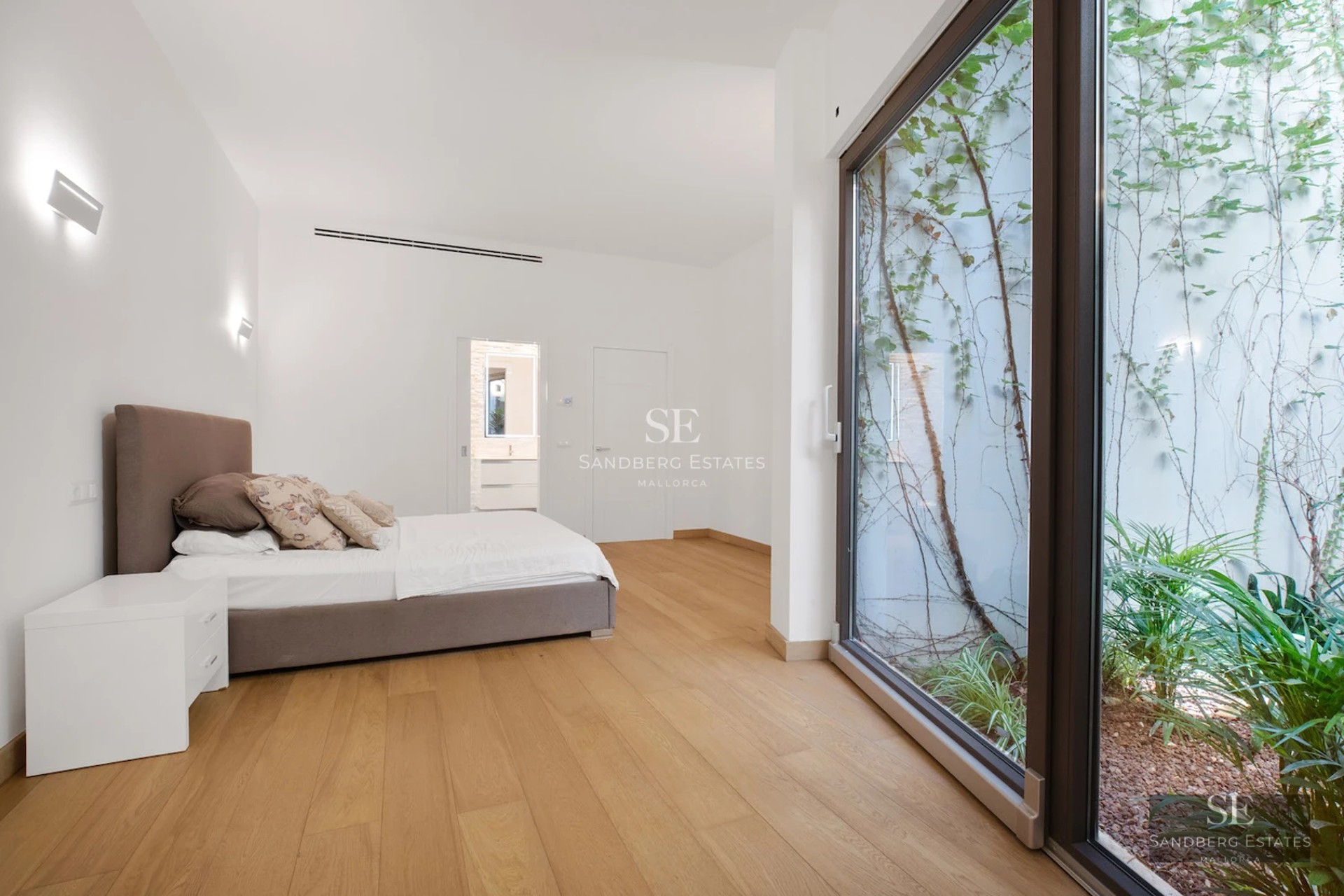 Spacious terrace with infinity pool and sea view. Modern design with elegant outdoor furniture. Soft ambient lighting.