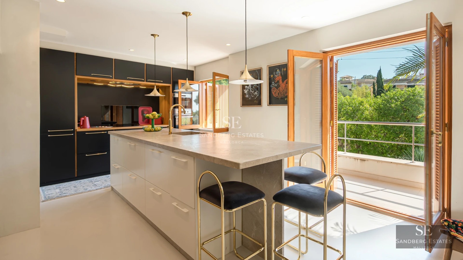 Spacious balcony with sea views. Modern furniture, light wood floors, and glass railing. Minimalist and elegant design.