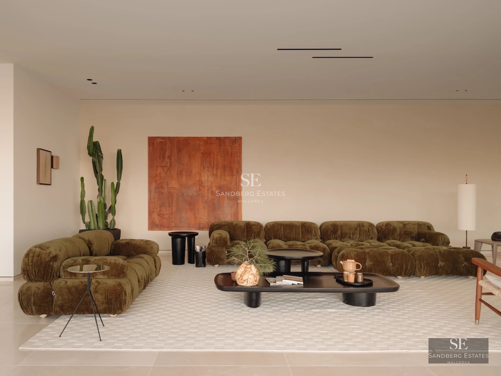 Expansive terrace with infinity pool. Panoramic views. Modern design with stylish outdoor furniture and lush vegetation.