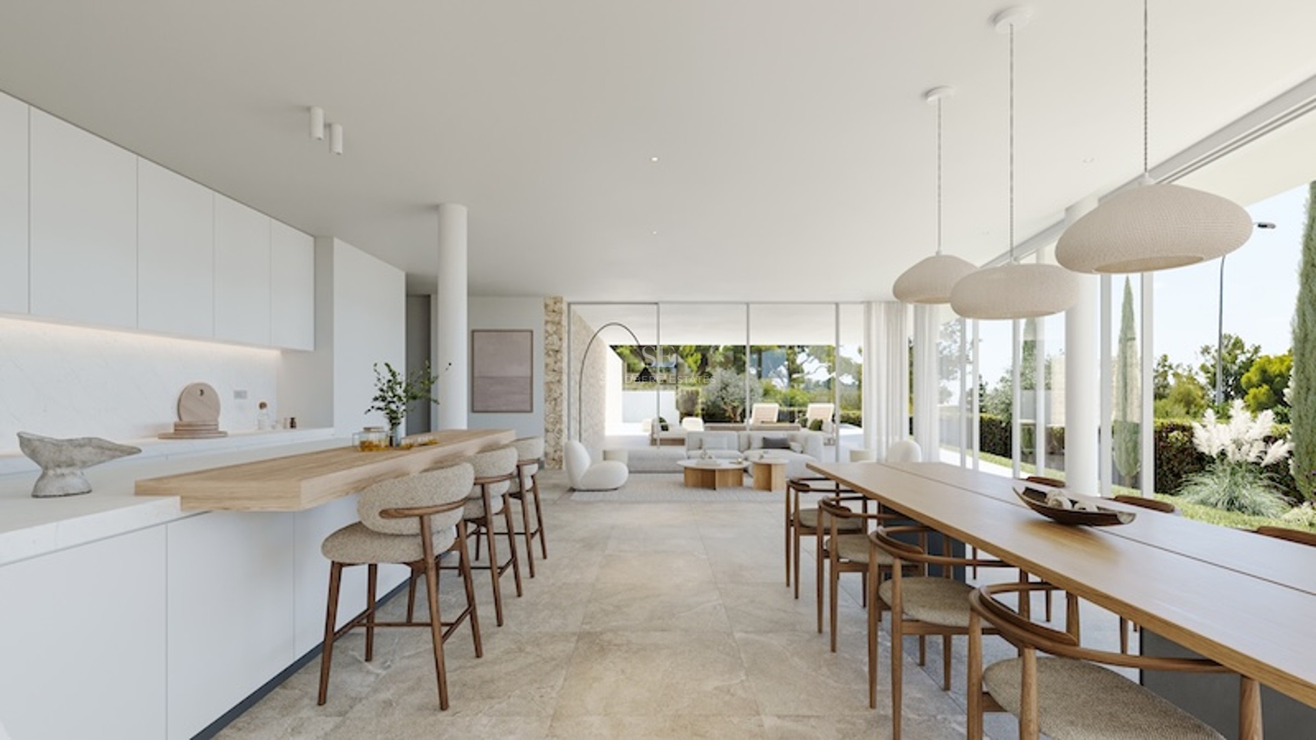 Vue grand-angle d'une cuisine blanche minimaliste et d'un coin repas avec de grandes baies vitrées sur un jardin.