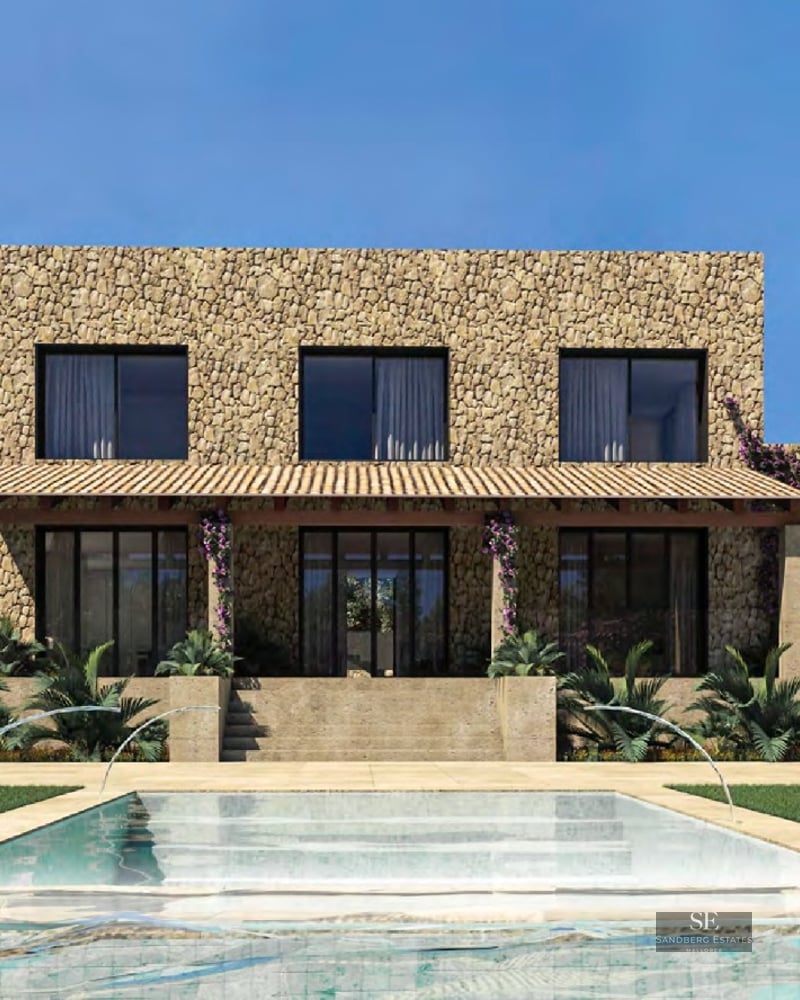 Modern stone villa featuring a designer pool with water jets, sun loungers, and Mediterranean landscaping.