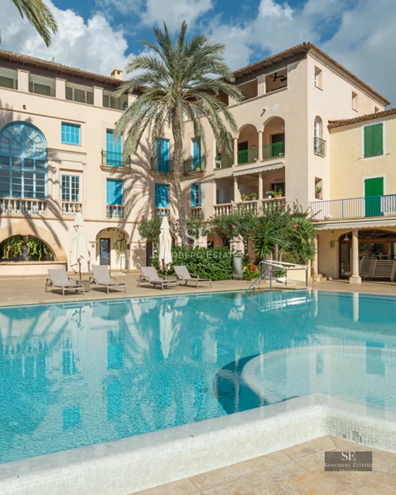 Expansive terrace featuring an infinity pool and ocean views. Modern design, stylish furniture, ambient lighting.