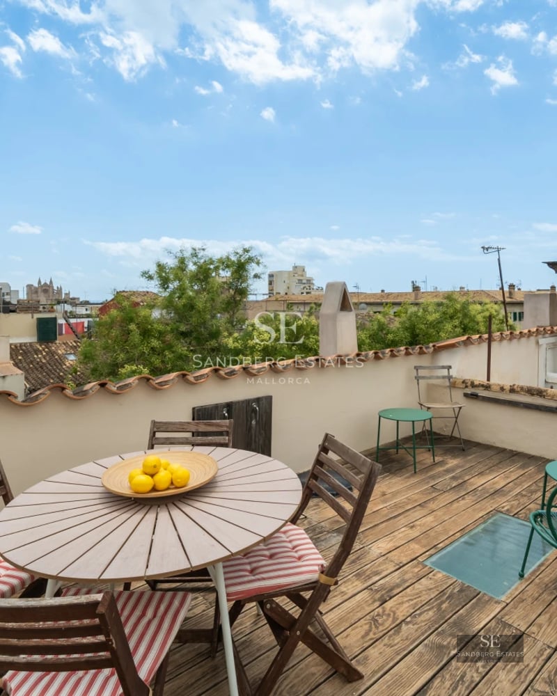 Spacious living room with large windows, a modern sofa, an elegant coffee table, and panoramic sea views. Minimalist and bright decoration.